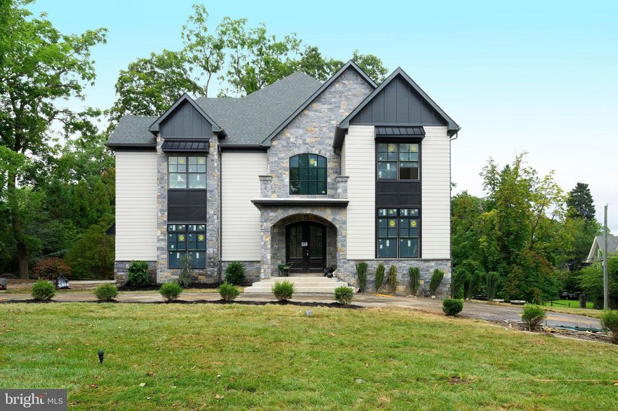 October delivery, exceptional new construction home set in desirable Wyndmoor. This five bedroom home boasts large, open entertaining spaces, including Viking kitchen with oversized island, custom hood, two Bosch dishwashers and custom inset cabinetry. Large great room with gas fireplace, coffered ceiling with sliders on two sides with access to private grounds, Trex deck and stone patio, large dining area with slider to Trex deck. First floor also includes two car garage access, living room and library with two sided gas fireplace, and powder room. Second floor includes 5 en suite bedrooms, including master suite with juliet balcony, walk-in closet, large master bath with two sided gas fireplace and second floor laundry. Finished, open lower level  includes a gym, full bath, glass enclosed wine cellar and large, open finished space.  All this and walk to the train, Fairmount Park and all the wonderful amenities Chestnut Hill and Wyndmoor have to offer.