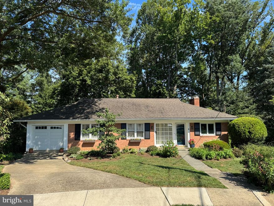 FANTASTIC $25,000. PRICE IMPROVEMENT!!! Only one stop light to D.C. and nestled in the charming Munson Heights/Arlingwood (AKA "OLD GLEBE") area, this delightful ranch-style home offers unparalleled convenience and community. Surrounded by an abundance of parks with tennis and basketball courts, soccer fields, dog parks, and walking trails to the Potomac and a community center, this location is a gem within Arlington.
 
 This well-maintained brick residence boasts OAK hardwood floors, 4 generously sized bedrooms, 3 updated full baths, and an updated kitchen. Made for entertaining guests and family, the property has a separate dining room and a spacious living room with a fireplace, and a set of sliding glass doors that provide access to the balcony...A great place for your morning coffee while viewing the private and lush backyard.
 

  Heading downstairs, find the fully finished lower-level, featuring a large rec room which walks out to the beautiful and spacious screened-in porch, overlooking the patio and very private backyard. Also on the lower level, you will find the laundry room, plenty of storage, a bedroom and full bath, plus two more rooms with an outside entrance that would make excellent home offices, au pair suites, hobby rooms, etc. Situated on a generous 0.37-acre lot, this property offers ample outdoor space and lush landscaping, a gardener's delight! The attached front-entry garage and the shed in the backyard provide convenience and additional storage. The roof, gutters, HVAC system, and hot water heater have been replaced. Schedule a showing now and come see your future home!