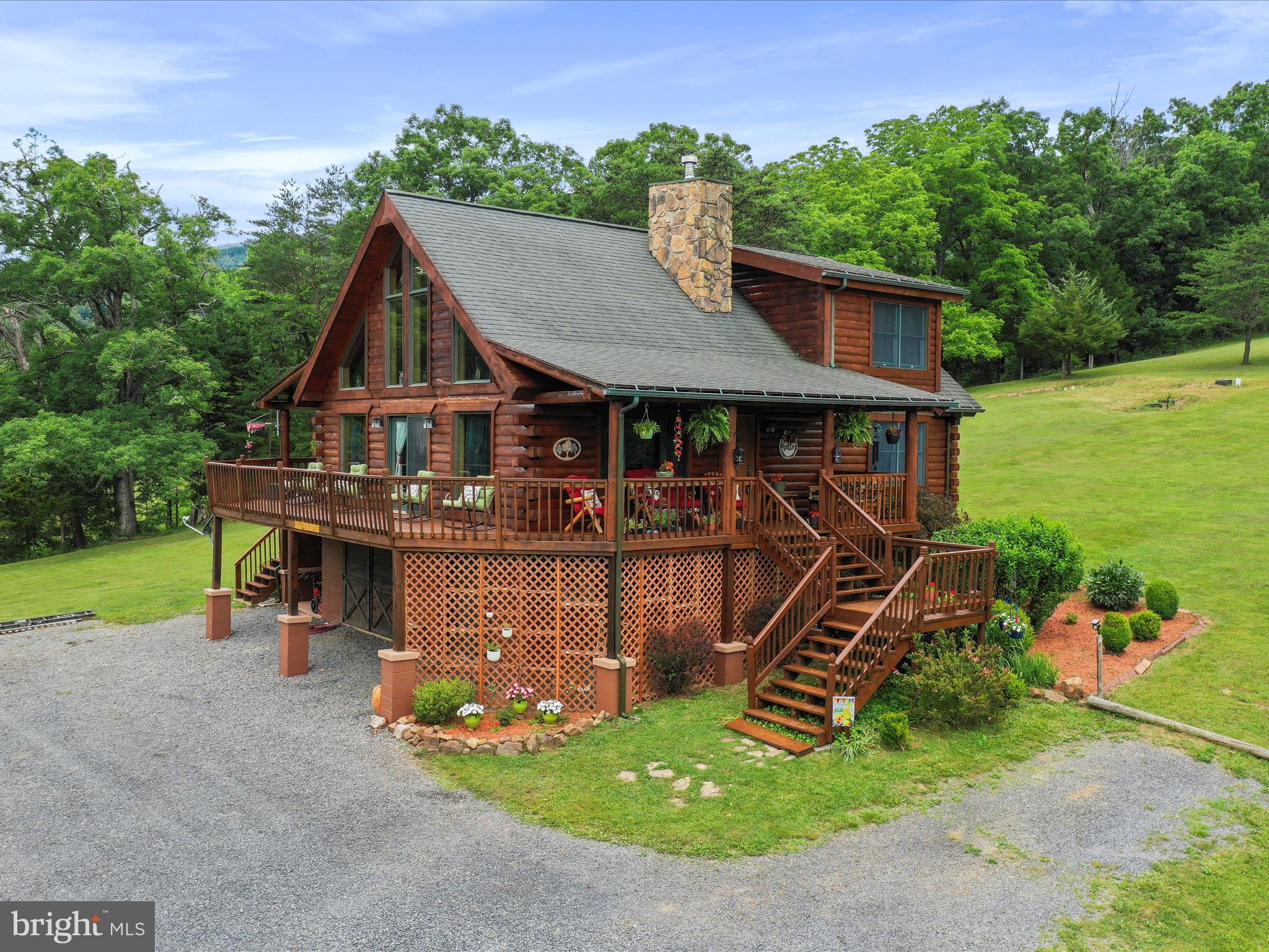 IDEAL AS A VACATION RENTAL (BnB) GETAWAY OR YOUR DREAM MOUNTAIN RETREAT IN SMOKE HOLE LEGENDS:
VA Assumable Loan
It is located next to the Mononghahela National Forest with endless opportunities to enjoy hunting, trout fishing, and for your ski buff, there are four premier ski resorts within a short drive. Welcome to this charming all cedar log home nestled in the heart of the mountains within the community of Smoke Hole Legends. This enchanting property embodies the essence of a rustic mountain getaway, offering a perfect blend of comfort, style, and functionality.
RUSTIC ELEGANCE MEETS COZY AMBIANCE:
As you step inside, you'll be greeted by the rustic elegance of this 90% all CEDAR home with tongue-and-groove log beams and warm wood flooring, which together create a cozy and inviting atmosphere. The spacious living area is the heart of the home, anchored by a majestic fireplace that promises warmth and a perfect gathering spot for chilly evenings.
VERSATILE LIVING SPACES:
This home features ( approximately 1064) square foot, walk out unfinished basement with garage door, capable of storing vehicles, four wheelers, and ATV's, or a boat...
This area can be finished to create a living space, game room, or whatever you desire.The main floor shows off the all new Whirlpool stainless steel kitchen appliances, installed June 2024. Refrigerator with water and ice dispenser, microwave, and 5 burner gas stove with convection oven... Brand new double stainless steel sink, and new granite counter top, also installed June 2024. open area for dining, a number of large windows opening up the space, and of course the fireplace, making the living space on the main level both practical and modern. The main floor also has 2 bedrooms and 1 full bath. The Primary bedroom on the upper floor is a sanctuary of tranquility, complete with a stunning master bath designed for relaxation and luxury after a day of mountain adventures. Also, there is a balcony with an open area that can be used as a reading room, an office or crafts area which overlooks onto the main level with an open view of the beautiful mountains.
OUTDOOR ENTHUSIAST'S PARADISE:
Step outside onto the expansive deck and be mesmerized by the breathtaking views of the surrounding mountains. The property includes landowner access to the nearby national forest, offering endless opportunities for hiking, fishing, and outdoor exploration. You'll find yourself just an hour's drive from three ski resorts and prime trout fishing spots on the North Fork of the South Branch of the Potomac River, placing you in the midst of all that West Virginia's eastern mountains have to offer.
MODERN CONVENIENCES IN A NATURAL SETTING:
This home offers the convenience of public water, and spring water. Installed 2.5 ton heat pump in March 2020. The cabin got a fresh coat of (Cabot) stain applied in June 2024.
Whether you're looking for a serene weekend escape, or an investment to use as a BnB, or even a permanent residence surrounded by nature's beauty, this all cedar log home in Smoke Hole Legends is the perfect choice. Don't miss the opportunity to make this mountain oasis your own and enjoy the best of mountain living.
