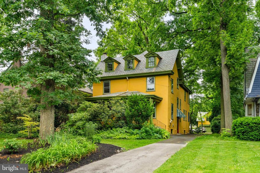 Welcome to this charming home in the sought-after Henry Albertson Historic District! This spacious 3-story residence offers 5 bedrooms, 2.5 baths, and a wealth of historic charm. The covered front porch spans the width of the home, providing a cozy retreat with a fan and light for added comfort.

The expansive sunlit living room features gleaming hardwood floors and a cozy wood-burning fireplace. Adjacent is a versatile space with built-in shelving, ideal for a den or home office. A spacious dining room connects the living room to the custom-designed, light-flooded kitchen, which boasts hand-matched birch cabinets, elegant soapstone countertops, gas cooking, and top of the line stainless steel appliances. A half bath with hand-cut mosaic tiles completes the first floor.

On the second floor, three bedrooms and sunroom feature hardwood floors and large windows. The classic bathroom boasts timeless black and white tile and a console sink. On the third floor, you’ll find two additional bedrooms with hardwood floors, and a large, easily accessible storage room. A full bath with a clawfoot tub completes this level. The sizable basement provides extra storage or potential for further customization.

The expansive backyard leads to the artist’s studio, a tastefully converted space that was once an oversized garage. This studio is equipped with modern amenities, including a mini-split system, sink, and a massive second floor with soaring ceilings. Additionally, the double doors facilitate the easy movement of large canvases, sculptures, and other substantial items, making it an ideal workspace for any artist.

Ideally located, the home provides easy access to shopping, entertainment and transportation. Immerse yourself in the vibrant local culture with Lansdowne's Symphony Orchestra and the Folk Club, explore fresh finds at the Lansdowne Farmers Market, and soak in the creativity at the Lansdowne Arts on the Avenue Festival. The Lansdowne library and several parks are a short walk. Don't miss this rare opportunity to own a piece of history. Schedule your showing today and make this captivating Colonial your new home!