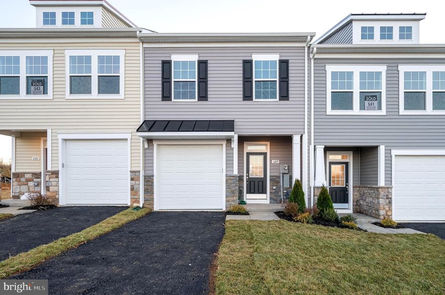 Discover luxury living in Berkeley County's premier planned community of Martinsburg Station! 605 Detroit Square is a stylish 2-level townhome featuring 3 bedrooms, 2.5 bathrooms, a covered front stoop, partial stone front, and 1-car garage. Enjoy high-end finishes like 9 ft. ceilings, a spacious kitchen with stainless appliances, white quartz countertops, and an open family room with access to a private oversized backyard patio. The primary suite boasts a large walk-in closet and private ensuite bathroom with dual vanities and a tiled shower with shower niche. Two additional secondary large bedrooms are also featured on the second level with a shared full hall bath. Laundry included and conveniently located off of the bedrooms. Enjoy community amenities like a clubhouse, pools, and walking trails with breathtaking mountain views. Embrace this opportunity for sophisticated, convenient living. Schedule a showing today and see if this is the home you've been searching for! Applicant(s) must be able to pass credit/background check. MINIMUM FICO CREDIT SCORE OF 650 REQUIRED FOR ALL ADULT APPLICANTS. No Smoking. Pets are case by case.