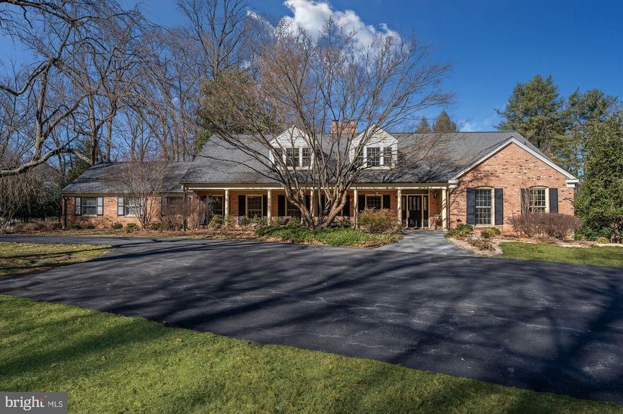 Don't be deceived...this quiet facade belies an amazing interior. Come settle into this fantastic, exquisitely crafted, 6,000+ SF, beautifully maintained Cape Cod.  It will become your personal oasis with  exceptional finishes and detailing inside and a gorgeous 2+ acre setting with an in ground heated pool, pool house and tennis court.  Unlike many Potomac Falls homes, this one has the coveted higher ceilings at 8'6".   The circular floor plan is perfect for family living or formal entertaining.  The main level offers two, private home offices for those now working from home.   Throughout the home you will find many custom details including lighted display cabinets in the Dining Room with a lighted tray ceiling and built-in china closets.  The formal Living Room has a gas fireplace with  jade surround.  The Gourmet Kitchen offers loads of storage and a large eat-in area.  Just off the Kitchen is the sunroom with three walls of windows overlooking the rear yard and access to the outdoor dining terrace.   The Main Level Primary Suite has a tray ceiling and access to the rear yard/pool for an early am swim or a late evening dip.  The sumptuous marble Primary Bathroom has double vanities, a soaking tub and stall shower.  Two large walk-in closets complete the Primary Suite.  Upstairs are three extravagantly sized bedrooms each with a private, en suite full bathroom.  Outside the bedrooms is a sitting area/homework/game room and a cedar closet.  The daylight, walk-out lower level is fully finished with a recreation room and potential exercise room with a full bathroom, steam shower and sauna.  The oversized three car garage provides lots of storage, if needed, and includes the pool equipment so it doesn't age sitting out in the elements.   You'll love the privacy you find in the backyard space with a large pool with an electric pool cover, a wonderful pool house with a full bath and a tennis court with "stadium seating" on the hillside.  The circular driveway offers lots of off street parking and allows for a half court basketball court.  In addition to all the amenities, this home has a commercial grade generator that will even heat the pool in the event of a power outage.   Ready for a simpler lifestyle...it's waiting for you here!