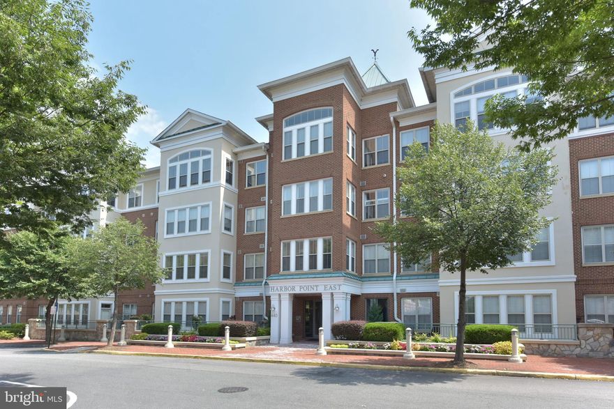 New Price! Enjoy this beautiful waterfront community...best kept secret in the area! You will feel like you are on vacation, this sparkling light filled condo is just yards from Belmont Bay/Occoquan River surrounded by miles of walking trails, next to a wildlife sanctuary and two blocks to Belmont Bay Marina! Don't have a boat- join the boat club, reserve a boat and enjoy! Desirable open floor plan, high ceilings, glowing hardwood floors and tons of natural light! Spacious living room with fireplace and built-ins opens to dining room and updated kitchen with stainless appliances, corian counters and maple cabinetry. 2 large bedrooms/2 full baths on opposite sides of home, master with walk-in closet. Sunroom/office is framed by windows and overlooks large inviting patio perfect for entertaining. Two underground parking spaces convey and bike racks are available. Workout gym is located in the building and community tennis courts and pool are near. Convenient to Woodbridge VRE commuter station, 30 minutes to D.C. Union Station in morning and 45 minute return, https://www.vre.org/service/map/  Plus easy access to I95, bus service to Pentagon and D.C., short commute to Fort Belvoir and Quantico. Near shopping and restaurants at Stonebridge and Town of Occoquan.