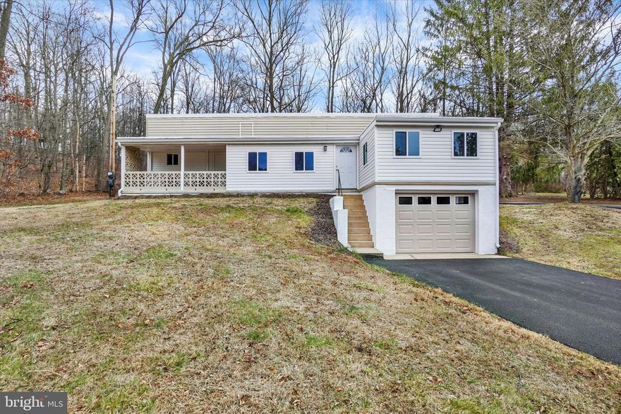 Super sweet little home in the country. This beauty has been fully restored from top to bottom. A brand new blacktop driveway will lead you right up around to the back patio door. Inside you're sure to love the open white kitchen with new appliances. All new floors of either carpet or laminate throughout. Two bedrooms and a full bath on the first level. Go down the stairs and you'll find an unfinished basement but there's a full bath and laundry area, a new sump pump was added so it is nice and dry now. This room could be finished for additional living space. Finish this area and have over 1300 Sq. Feet under your roof. Then there's the huge 364 Sq. foot, front loading garage with a new insulated door and opener. This garage has room for not only your car but other toys or workshop space as well. This home has all new insulated windows and doors, not one but two mini-splits for year round comfort. The main heat is oil FHA. Sit on the large covered front porch or on the rear deck and have your favorite drink in your hand,  the choice is yours. This is a move in ready home and is less than a half mile off Rt 74. Private but super accessible to the highway. Sitting high and backing to wood land full of deer. Want country living at a very affordable price tag with low, low taxes.  This one is it. Take a look and you'll want to call it home.