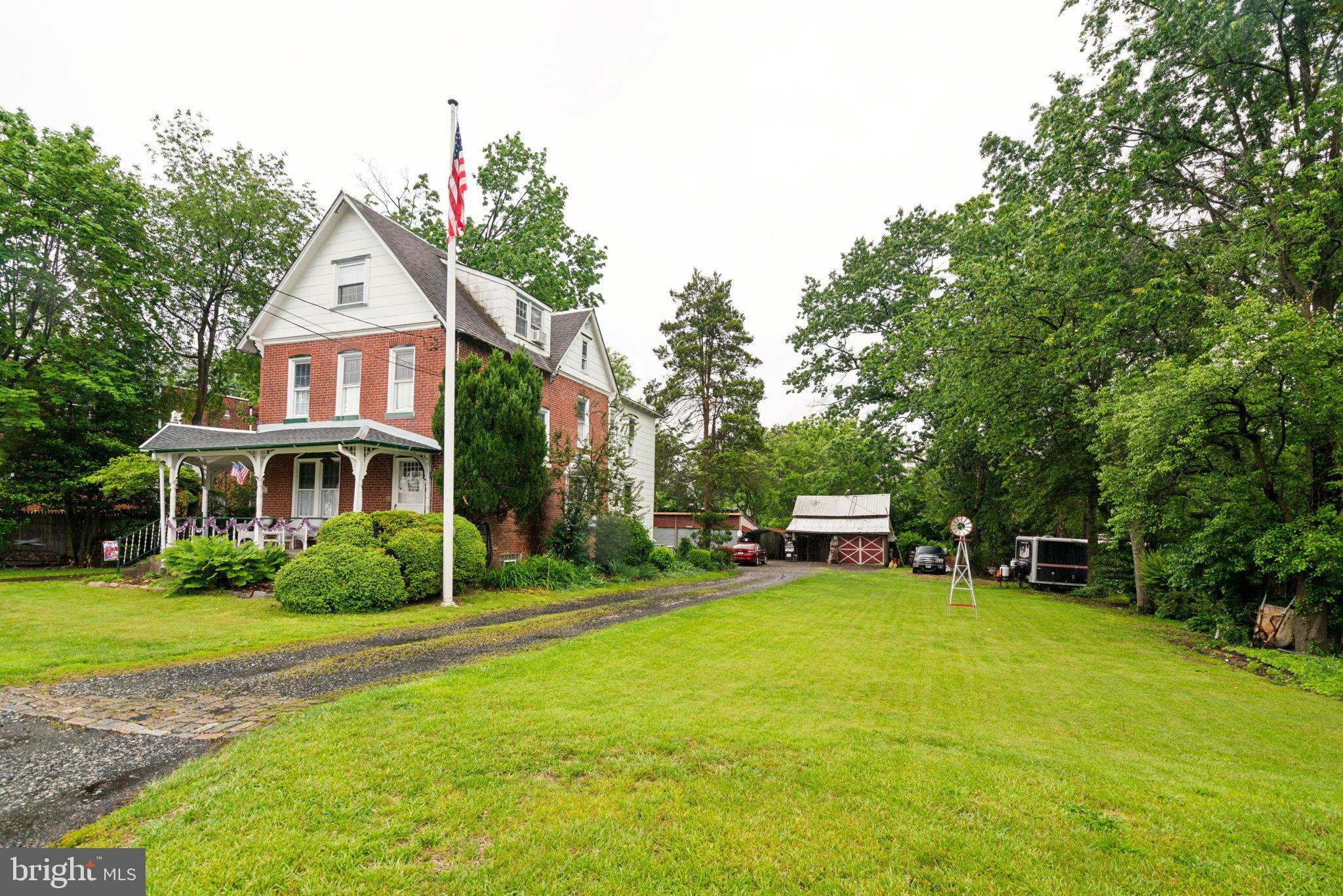 This charming and beautifully maintained 4 bdrm Victorian home will turn back time! A unique blend of classic character with modern comfort, from the covered wrap-around front porch to the detached post & peg carriage house. Step inside the inviting first floor featuring a cozy living room with a wood burning fireplace and just steps away from a huge formal dining room and an updated kitchen with ample maple cabinetry, gas stove, dishwasher, garb disp, pantry and a huge bay window overlooking a patio, gardens, 4 garages, 2 story custom play house, green house, chicken coop and a spectacular carriage house with water & electric. . Off the kitchen is a convenient full bath and a mudroom/laundry rm with exit to the amazing rear yard. There are 2 staircases, the back staircase leads up to the mstr bedroom with his and her closets, a 4 piece hall bath with stall shower & clawfoot tub and 2 additional bedrooms. The 3rd flr leads up to the 4th bdrm with a large side attic, It also could be an office, a private retreat or a teen hangout for movie night and gaming . All new beautiful extra long windows with decorative sills throughout and a 6 yr old HVAC system. There is a full basement with plenty of storage and access to the backyard and patio. The upper 2 floors offer 2 options...a 4 bedrm single family home or you can create flexible living arrangements for family or guests, because the 2nd floor has a fire door available in the hall, between bedroom 2 and bedroom 3. It can divide so 2 bdrms are private, one on the 2nd flr and another on the 3rd flr. These 2 rooms can have their own separate entry door and front staircase if needed for flexible living arrangements. This home is so versatile, ready to become whatever best suits your family. There's a security system, ceiling fans & recess lights. Parking is super easy w/plenty of driveway space for multiple cars and additional street parking options. Great for a business owner that needs lots of storage areas and parking for equipment & trucks. Nestled on a lovely tree-lined street in the heart of Bustleton, you'll love the easy and enjoyable natural beauty all around this true hidden gem on .47 acres. This was a working farm not too long ago with many different farm animals.