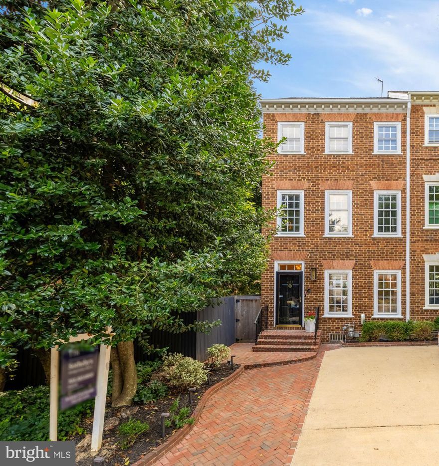 OPEN HOUSE CANCELLED for SUNDAY 06/29/25 .  Welcome to timeless sophistication nestled on one of Old Town Alexandria’s most charming, tree-lined streets. This exquisite end-unit townhouse, crafted by renowned builder Cullinane, is a rare offering—blending classic architecture with modern luxuries across more than 2,300 square feet of beautifully designed living space.

Step inside to discover a thoughtfully designed floor plan, where soaring ceilings, rich hardwood floors, and intricate custom millwork create a warm and refined atmosphere. Three fireplaces add charm and comfort, while abundant natural light enhances the home’s inviting appeal.

At the heart of the home is a stunning gourmet kitchen, complete with an oversized quartz island, premium appliances, and elegant finishes—perfect for everyday living or entertaining in style. The open-concept main level flows seamlessly from a cozy dining nook to a gracious living area, centered around a gas fireplace and framed by expansive modern sliding glass doors. These lead to a private, brick-walled patio—your peaceful outdoor retreat in the heart of the city.

As an end unit, the property also features a convenient side alley, ideal for storing bikes and outdoor essentials. A discreetly tucked-away powder room adds functionality for guests on the main level.

Upstairs, the luxurious owner’s suite serves as a serene escape, featuring a wood-burning fireplace and a beautifully appointed en-suite bath. A second bedroom—currently configured as a home office—shares this level with a full bath and a conveniently located laundry closet.

The third level offers two additional generously sized bedrooms, one thoughtfully styled as a relaxing hangout space, along with a full bathroom and walk-in storage.

Crowning the home is a spacious loft-style family room, where sliding doors open onto a spectacular Trex rooftop deck. Complete with an outdoor fireplace and sweeping sunset views of the iconic Masonic Temple, this space is perfect for unforgettable evenings and leisurely weekend mornings.

Additional features include an inviting new brick walkway, a new slate roof, a Tesla EV charging station and a private driveway , an invaluable  luxury in Old Town.

The location is truly unbeatable: just six blocks from the scenic Potomac River, one block to Lyles-Crouch Elementary School, and four blocks from the shops, restaurants, and charm of King Street. Commuters will appreciate easy access to the King Street Metro (1 mile away) and Reagan National Airport (just 3.5 miles).

Listing agent has an ownership interest in the property.