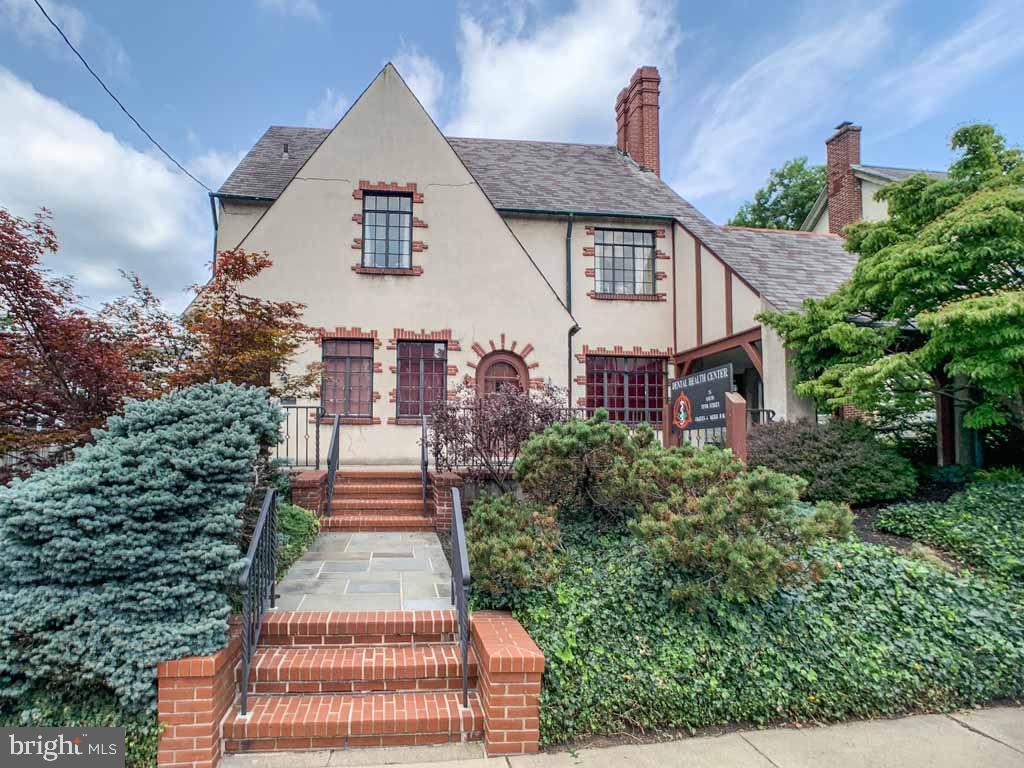 Welcome to the Historic Mark Thatcher home ! Originally built in 1927 (tax record is incorrect) located within the Perkasie Olde Town District. The present owners have owned this beautiful home and office (zoned mixed use residential/professional ) since 1987 and have lovingly maintained and upgraded throughout. The home is now a 5 bedroom, 3 full bath  residence with an approximately 1,090 sq. ft. former dental practice with 2 half baths, separate central air conditioning and heating zones, with entrances in the front and from the lovely covered flagstone porch. The dental equipment will be removed prior to settlement. The area would be ideal for a professional office or possibly converted into a 2 bedroom apartment or In -Law Suite (check with the Boro.) As you enter the residence from the end of the driveway,  you are in the large living room. A wood burning fireplace with custom built natural cherry mantle, built-in cabinets and display cases, and wall speakers provide a warm comfortable area to entertain and relax on a winter night. Next to the living room is a formal dining room that will comfortably seat 10 guests or family. The French doors at one end  provide for a bright airy atmosphere. The open concept kitchen which has been totally up graded with granite counters, custom natural cherry cabinets and modern appliances,  including a Sub Zero refrigerator with matching cherry doors as well as an overhead pot rack, make this a chef's paradise. On the second floor you will find 3 bedrooms and 2 full baths. The master retreat features a large breathtaking bathroom with stunning custom built (by owner) natural cherry, marble top vanity with double sinks, fully marble- tiled stall shower and 2 person jacuzzi. French doors lead into the master bedroom. Another set of French doors lead you into the den,  office, or 2nd bedroom. A second full  bath is shared with this room and a third bedroom . The 3rd floor features 2 wall to wall carpeted large bedrooms each having built in shelves and bench seats under the windows, providing cozy, quiet reading nooks or daydreaming. A full bath with travertine tiled floor and bath surround  overlooks the backyard . All the bedrooms are light and airy. Attention to detail is displayed  throughout.  Clear (no knots) red oak floors and natural cherry jambs surrounding the 6 panel solid wood interior doors and original casement windows  preserve the historic design.  The back yard is irregular and a survey may be in order to determine the actual boundaries.This home is meticulously crafted and very reasonably priced to sell at approximately 134/sq.ft.