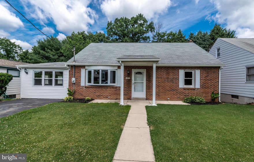 Fantastic renovated brick 3 bedroom/1.5 bath Rancher!  All new flooring and fresh paint.  Design changes completed to improve flow.  Walk-up attic space transformed into a lovely room with a pitched ceiling, big closet, and natural light.  Kitchen and bathrooms completely redone.  Stainless steel appliances.  Family room use is open to your specific needs.  Big enough to create a separate dining area.  Exposed brick and built-in shelving adds charm.  Sliding glass door leads to the new deck and down to a level back yard.  Full basement offers a large finished area complete with a half bath.  Plenty of storage in the laundry area and the mud room.  This home has it all!