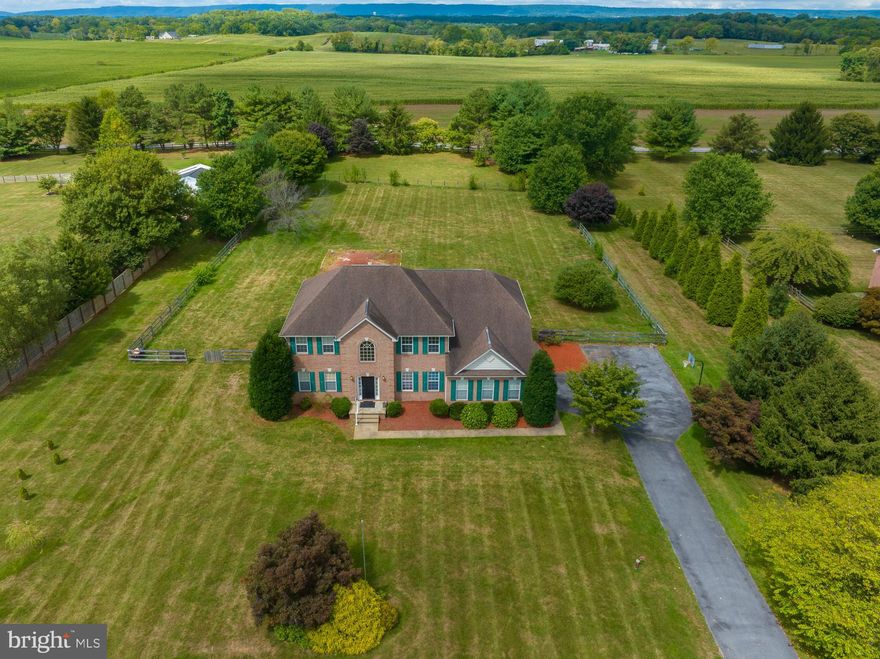 Wonderful  large  lot with mature trees and specimen plantings - just beautiful.   As is the home.  Almost 5000 sq feet. Enter to a 2  story foyer - on the right are french doors leading to an office -  left side is open to formal living/dining room.  Straight back is the  island kitchen which opens to a family room with a fireplace. Love the large windows letting in plenty of light.  There's a 37 x 16 rear deck off the kitchen with a large gazebo - a great entertaining, hanging out private area to enjoy that huge back yard .  Back yard is totally fenced.  Lots of room for badminton or volley ball.   Upstairs there's 3 bedrooms and a large primary bedroom with a beautiful en suite bath. VIEW to the mountains.   There's a walkout full finished basement with  bonus room and full bath. - all freshly painted - also an unfinished area for storage.  Home is in a large lot subdivision in a lightly  populated part of Berkeley County - out in the country but not far, minutes,  from shopping and amenities.  11 min to Shepherdstown and Martinsburg.  11 min to MARC train.  Great Location - Great property.  Be sure to take the self directed virtual tour and take a stroll through the house.  Floor plans are in documents.