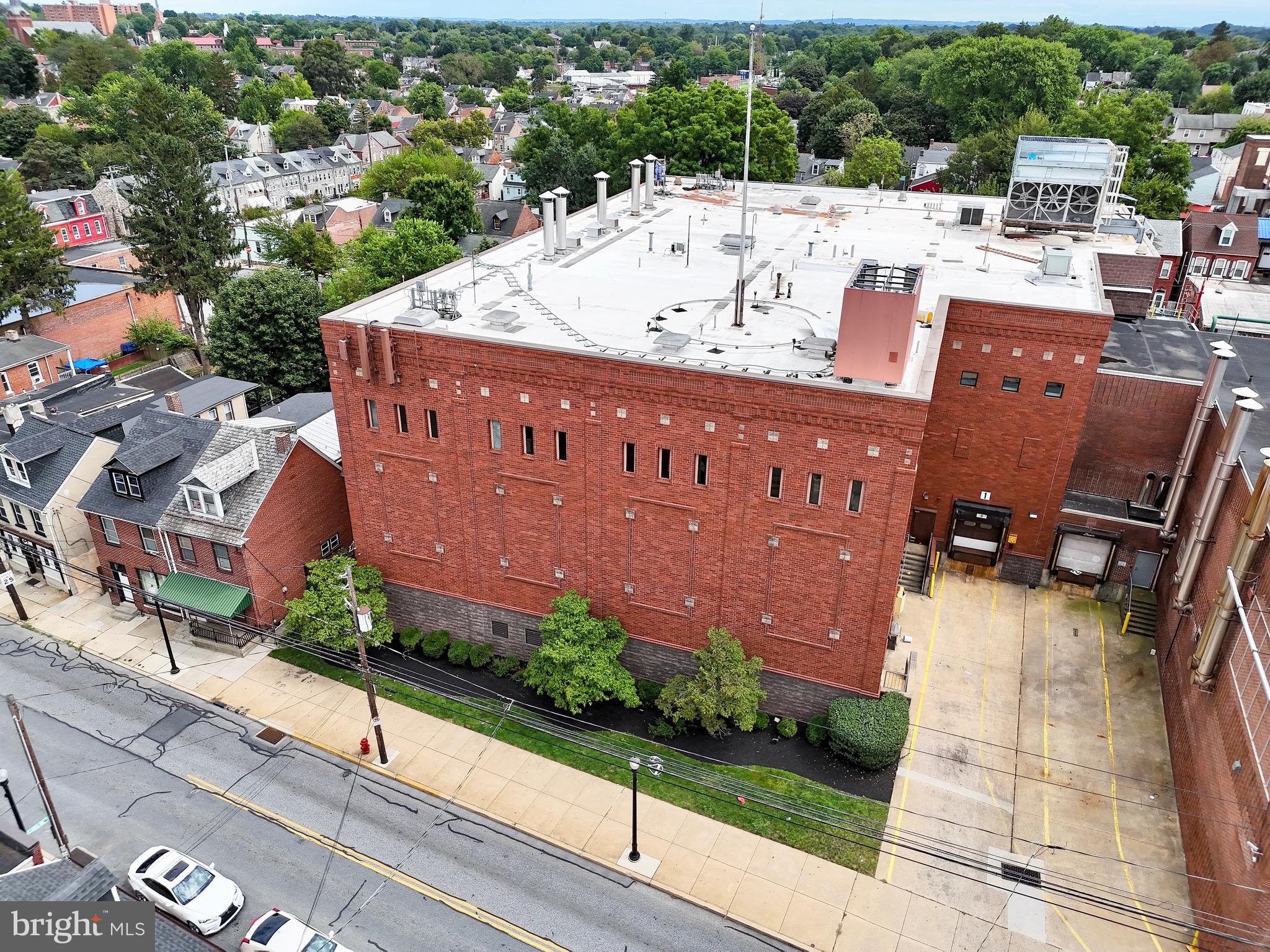 Positioned on a key corridor in Lancaster City, this portion of the former Kunzler hot dog factory is a blank slate for your use. Featuring freight elevators, 4 loading docks including a couple with levelers, and up to 18' ceilings the space lends itself well to continuing its legacy in food manufacturing, or a wide array of other potential uses with its commercial/industrial zoning.
Whether you’re scaling distribution, expanding regional reach, or seeking overflow capacity, the property offers a strategic location and some ready-to-use infrastructure to accomplish your goals quickly. The amount of space offered is flexible, can be less for those on a tighter budget, or much more on additional adjacent property that could be retrofitted or build to suit; about 1.3 acres in total are available for this.
CAM fees will start at $1.50/SF. A 5 year lease would be optimal, but for the right tenant can be quite flexible. Included in the lease are 8 dedicated parking spaces, with lots of additional spaces available for $50/month each. With some upgrades this can easily become a clean, efficient, and highly functional storage or workspace. Take your opportunity to be positioned in the path of growth in a growing part of downtown Lancaster!