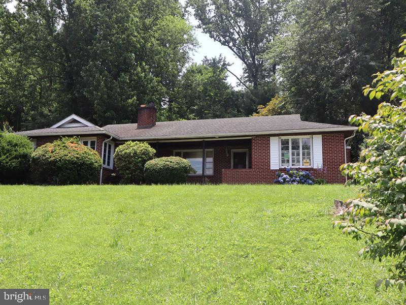 Welcome to this spacious 2,055 sq. ft. single-family home, built in 1952 and located in the desirable Coatesville section of Chester County. This property offers abundant living space and timeless character.
Step onto the inviting, open front porch before entering a large living room that flows seamlessly into the dining area. The kitchen and adjacent family room provide plenty of space for gatherings and feature a convenient laundry area with direct access to an oversized rear patio and a fenced backyard—perfect for outdoor entertaining. The home includes three generously sized bedrooms with ample closet space and 1.5 bathrooms. A full unfinished basement offers endless possibilities for storage or future expansion. Additional features include a rear storage shed and private driveway parking. This home blends classic charm with functional space—don’t miss the opportunity to make it your own!
