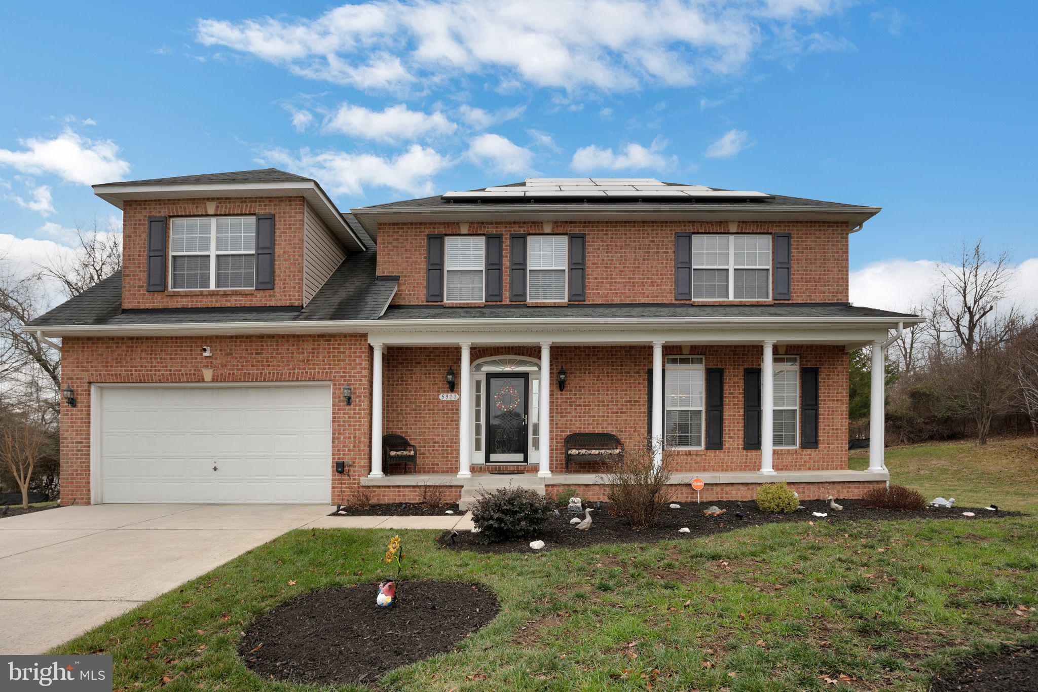 Stunning stately brick front home boasting exceptional curb appeal. Welcoming front porch leads you into the elegant foyer area complemented by a convenient powder room. The open kitchen features breakfast area which flows seamlessly into the cozy family room with gas fireplace. Also on the main level is a formal dining room and living room, boasting plenty of natural sunlight. Moving on to the upper level where you will find the spacious primary bedroom featuring a sitting area, walk-in closet and luxurious private bathroom designed for relaxation and comfort; three additional bedrooms and hall bath complete the second level. The expansive unfinished walk out lower level offers limitless potential. Custom deck overlooking serene, private backyard, 2 car garage; situated on large lot. Brand new AC 2024. New garbage disposal. This home is convenient to shopping, schools, restaurants, parks, transportation and major routes. Welcome Home!