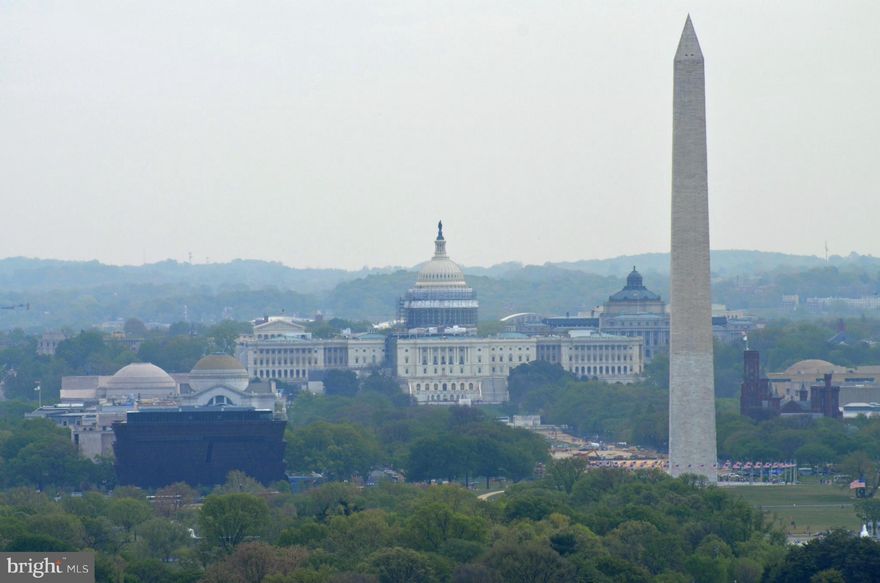 OMG - view of the DC monuments!12th Fl Luxury condo w/2 balconies w/amazing views, 2 prime parking spaces & 2 storage units. Cherry cabinets w/brushed nickel contemp hardware, top of the line appliances - Miele BI coffee maker, SubZero refrigerator, wine cooler, Wolf gas cooktop, Viking Range hood, Double oven - convection, breakfast bar/island. Fam rm w/built in cab w/TV & wet bar. Upgraded baths