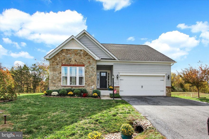 Looking for privacy? Nestled on a quiet cul-de-sac in Cumberland Crossing at The Links of Gettysburg, this charming ranch-style home offers the perfect blend of comfort, convenience, and peaceful surroundings just south of historic Lincoln Square in Gettysburg and moments from the MD/PA line. This move-in-ready home features an inviting open-concept layout with 9-foot ceilings, crown molding, and light-filled living spaces. The living room boasts a gas fireplace with a handsome stone hearth and built-in seating, while the eat-in kitchen shines with stainless-steel appliances, granite countertops, and a breakfast bar. A first-floor laundry room with pantry and coat closet adds everyday practicality. The primary suite includes a walk-in closet and private bath with a walk-in shower, both with handy space saving sliding doors. Downstairs, the finished lower level features a 38’ x 16’ family room with recessed lighting, plus a 353-square-foot unfinished utility area with a gas water heater, gas HVAC system, radon mitigation system, 200-amp electric panel, and sump pump perfect and plenty of room for storage or future expansion. Outdoor living is easy with an 8’ x 6’ covered concrete front porch and multi-level rear decks (10’ x 10’ and 11’ x 10’) overlooking a wooded backdrop for privacy. A wonderful opportunity to enjoy one-level living in a peaceful, well-kept community near golf, shopping, and all the charm of Gettysburg!