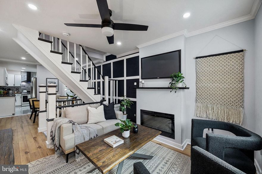 Welcome to this charming 3 bedroom, 2 bathroom Fishtown home, located on a wonderful block just steps from some of the neighborhood’s most popular spots. Recently fully renovated, this property blends timeless details with modern comfort. The sunlit living room offers a chic electric fireplace with custom mantle, crown molding, recessed lighting, and contemporary ceiling fan. Connected by a custom accent wall, the dining area is the perfect setting for entertaining or everyday meals. The kitchen showcases white shaker cabinetry, quartz and butcher block countertops, a marble-tone floor, subway tiled backsplash, and stainless steel appliances. Step out to a private rear garden, ideal for grilling, dining, or outdoor relaxation. Upstairs you’ll find two bedrooms separated by a spa-like bathroom complete with luxurious soaking tub, marble-tiled shower with glass surround, and a convenient full-sized washer and dryer. The fully finished basement with egress adds even more flexibility, offering a second full bath and a versatile room that works beautifully as a guest suite, home office, or additional living space. Warm wood flooring, recessed lighting throughout, and central air add to the home’s appeal. All of this in an unbeatable location, just doors from ReAnimator Coffee, steps away from Loco Pez, Cedar Point, Starboard Side Tavern, a short walk to City Fitness, and easy access to I-95. A turnkey opportunity to enjoy modern living at a great value in the heart of Fishtown!