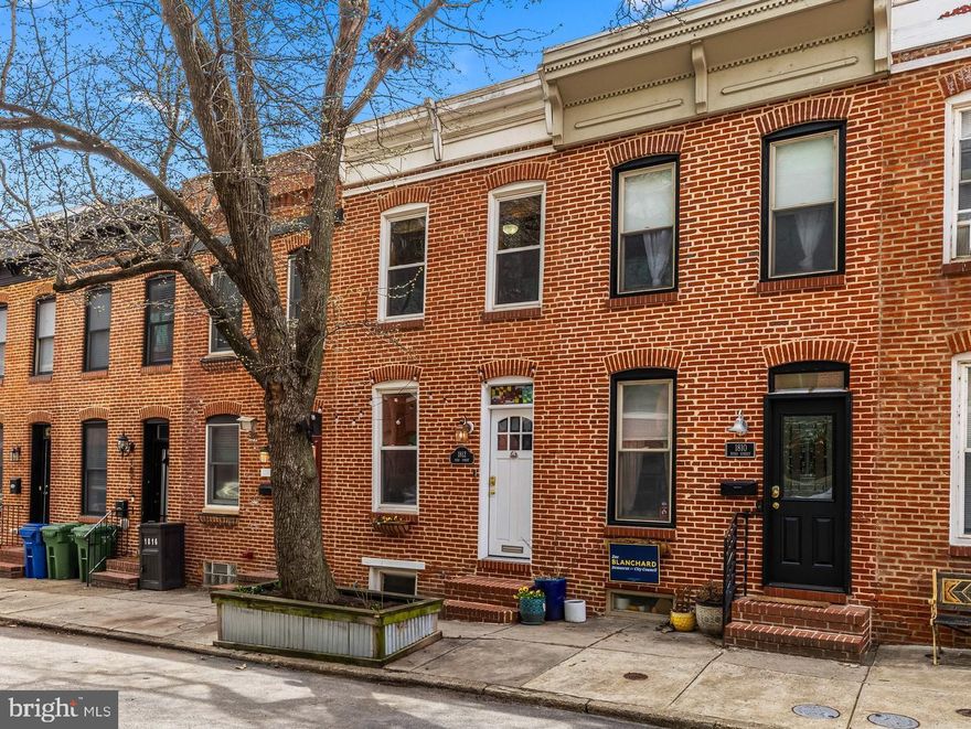 Welcome to 1812 Byrd St, a move-in ready home located on a tree-lined street in South Baltimore’s Riverside neighborhood! This 125+-year-old rowhome features 2 bedrooms, 2.5 bathrooms, 1 car parking, and a roof deck! As soon as you step inside this beautiful home you will admire how historic details are seamlessly integrated with modern amenities. Classic elements like the original floors and staircase have been restored, while a renovated kitchen with white shaker cabinetry, stainless steel appliances, and granite countertops bring this home into this century. The main level follows a traditional floor plan with a large living room, spacious dining room, powder room, and massive kitchen with space for a table. Out back you will discover a parking pad for 1 car. Upstairs includes a large guest bedroom with high ceilings, a cedar closet, and oversized windows for natural light, plus a hall full bathroom with a jacuzzi tub. The primary suite includes a large closet, space for a king-sized bed, and an attached private bathroom with a full-body jetted shower system. Entertain all summer long on the massive rooftop deck that offers City skyline views. The lower level is unfinished and is home to the laundry, mechanical systems, and ample storage space. Located 1 block from Riverside Park with pool, playground, basketball courts, and a new pickleball court. Short commutes to the University of Maryland Medical Campus and Johns Hopkins Hospital. Easy access to Cross Street Market, the brand new Baltimore Peninsula, Inner Harbor, and the stadiums.