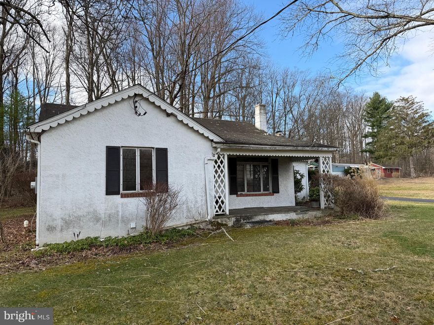 This charming 2-bedroom, 1-bathroom cottage, built in 1948, presents a great buying and/or investment opportunity in a serene rural setting. Spanning 1,214 square feet, the property features an unfinished basement, providing potential for additional living space or storage. The interior boasts a cozy atmosphere with a free-standing fireplace, and a dedicated dining area, enhancing its appeal for future buyers or tenants. The exterior is complemented by practical features such as awnings and flood lights, ensuring both comfort and security. The expansive 2.48-acre lot offers ample outdoor space, ideal for landscaping or recreational activities, which can significantly increase property value. Located in a tranquil area, this property has a ton of potential and looking for the right buyer or contractor.