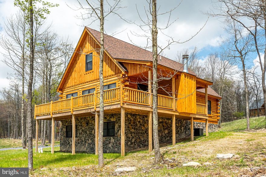 Rare Deep Creek-area two-parcel offering! 50 Blue Mountain View is being offered with adjoining Lot 34 Blue Mountain View, creating approx. 1.22 total acres in McHenry’s Lodestone/Biltmore area. Currently operating as the vacation rental “John’s Place,” this mountain-view 4BR, 3 full/1 half bath retreat sleeps 10 and is ready for continued rental use or personal enjoyment. Built in 2022, the single-family home offers approx. 1,708 sq ft on a 0.58-acre homesite near Deep Creek Lake, Wisp Resort, Funland, skiing, hiking, dining, and year-round attractions. The unfinished basement provides excellent opportunity for future expansion, with room to create a game room, bonus living area, or potential additional bedroom space, subject to applicable requirements. The included 0.64-acre adjoining Lot 34 adds valuable elbow room, privacy, and future possibilities. Buyer to verify rental permits/regulations, occupancy, HOA requirements, utilities, acreage, and Lot 34 buildability/permitted uses.