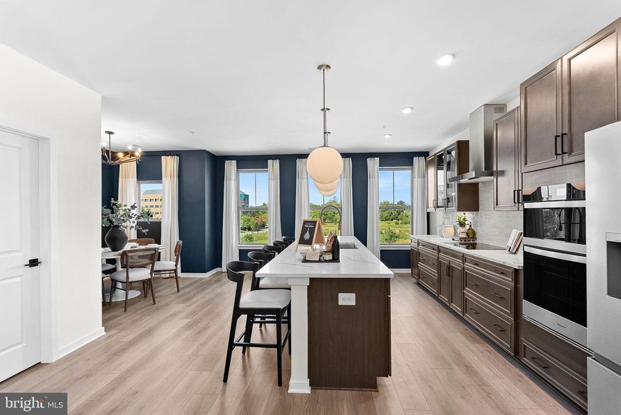 NEW CONSTRUCTION. BASE LISTING. Brand-new, upscale 1 car garage 2-level home available for immediate move in. Welcome to the Hepburn, a brand-new, upscale stacked townhome in the sought-after Belmont Park community in Ashburn, VA. This 2-level home with a 1-car garage is designed for convenience and style—perfect for those ready to move quickly! Featuring 3 bedrooms and 2.5 baths, this home boasts a modern kitchen with 42” cabinets, LED lighting, granite countertops, and stainless-steel Whirlpool appliances. options like Cooper’s Hawk Winery and TopGolf. Limited-Time Incentives: Get $15K in Closing Costs and for a very limited time $5K in Options until 1/31. Hometown heroes get $2,500 (restrictions apply; see New Home Counselor for details). The spacious primary suite includes a generous walk-in closet and a luxury bathroom with raised double vanities and a walk-in spa shower. Plus, the garage comes equipped with an EV charger-compatible outlet for future-ready living. Enjoy low-maintenance living with snow removal, lawn care, and exterior upkeep all handled for you—giving you more time to enjoy life, not maintain it. Belmont Park offers resort-style amenities including bocce ball, volleyball, playgrounds, community greenspace, and more. These homes are DOE Zero Energy Ready Homes™, built for efficiency and comfort. Located in Ashburn, you’ll have quick access to major roadways, Dulles Airport, and endless dining and entertainment. Model Home Hours: Mon–Sun, 10 AM–5 PM. Use 19758 Misty Moss Square Ashburn, VA 20147 for GPS directions. Parking will be next to our Information Center trailer.