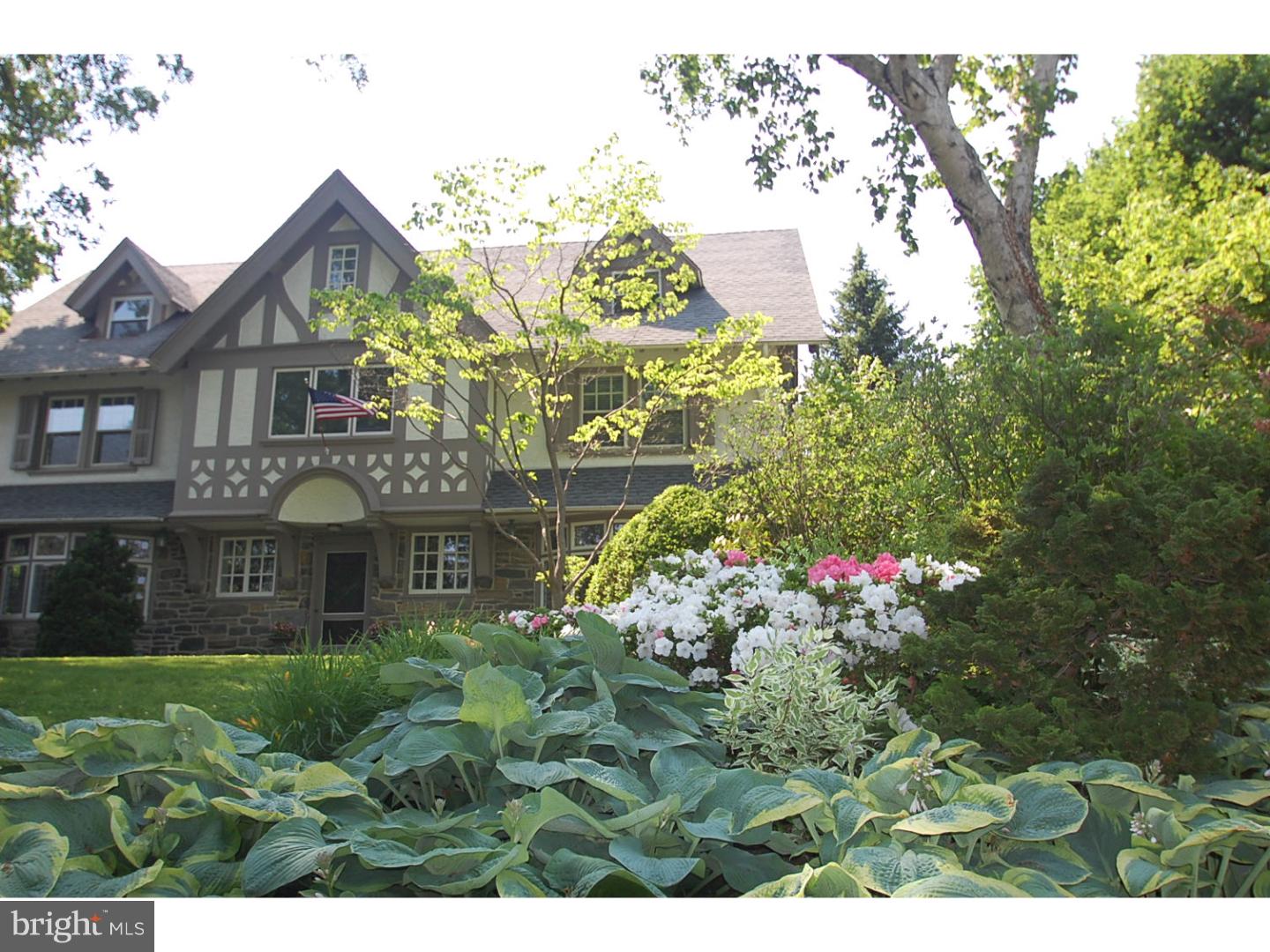 Elegance and charm abound in this turn of the century Tudor style colonial. This very special 5 Bedroom, 3 full and 2 partial Bath homes invites comfortable family living on 3 cheerful, beautiful stories. This classic home was built in 1905 and shares the beauty of old world charm with the convenience of modern amenities and upgrades. Step into the sunlit foyer and allow yourself to observe the extensive millwork and hardwood floors throughout the open First Floor. Enjoy casual gatherings or formal entertaining in the Living Room with French Doors to a covered Porch, a grand stone fireplace and large leaded glass windows contribute to the ambiance of the home. The Dining Room with matching leaded glass windows is a perfect setting for the meals you'll love preparing in the renovated Kitchen with granite counters, radiant heated tile floor, breakfast bar and gourmet stainless steel appliances including gas cooking, double ovens and sub-zero refrigerator. There is a Butler's Pantry/Mudroom with an additional sink, icemaker and storage. Completing the main level is a Den with a brick fireplace and built-in bookshelves. It is the perfect space for a TV Room, office or just curling up with a good book. The Main Floor has a beautiful marble Powder Room. SECOND FLOOR: The Master Suite welcomes you with an impressively detailed entrance hall with closet and new marble Master Bath including double vanity, stall shower and soaking tub. The exquisitely updated Master Bedroom has a large custom fitted walk-in closet and a separate shelved closet. In addition there is an upstairs Sitting Room. There are 2 additional Bedrooms and an updated Hall Bath. Perched on the third floor you will find an additional 2 Bedrooms, an Office and an updated Hall Bath with stall shower. Elegant refinished hardwood floors flow throughout most rooms of the home and a full basement provides another gathering space as well as ample room for storage. The back yard is a wonderful setting for relaxing or outdoor recreation with an in ground pool,covered porch and underground sprinkler system. The desirable central location in the historic district of Ardmore affords you award winning Lower Merion School District and easy access to public transportation and Amtrak direct to New York. Walk to Suburban Square and all the amenities it has to offer. This home is a Main Line Gem! ** C/A on 2nd and 3rd Floor