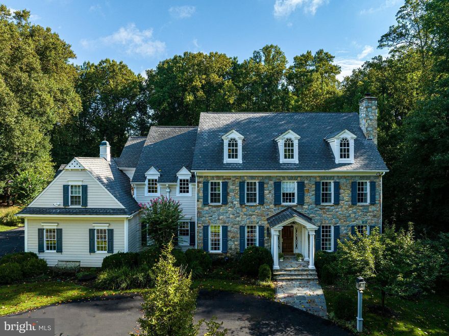 Tucked away down a country lane, this custom fieldstone home is perfectly sited on a gorgeous 2.5 acres in the heart of Great Falls!  Thoughtfully designed, highlighting beautiful wainscoting, coffered ceilings, and expert millwork craftmanship, this elegant home offers modern conveniences throughout marrying form and function.  The heart of the home features state-of-the-art appliances and ample space for family or guests to eat and relax.  This home will not disappoint, offering 7 bedrooms, 6 full and 2 half baths on 4 levels, a 3rd floor perfect for an au-pair or in-law suite, and a full walk-out basement to meet all your recreational needs.  Offering a gorgeous outdoor living space showcasing gas fireplace and flagstone hardscape with large pavilion and built-in grill while surrounded by beautifully landscaped yard and plenty of room for fun and games.
Conveniently located near the highly sought after L’Auberge Chez Francois.  Do not wait to make this amazing home yours today!