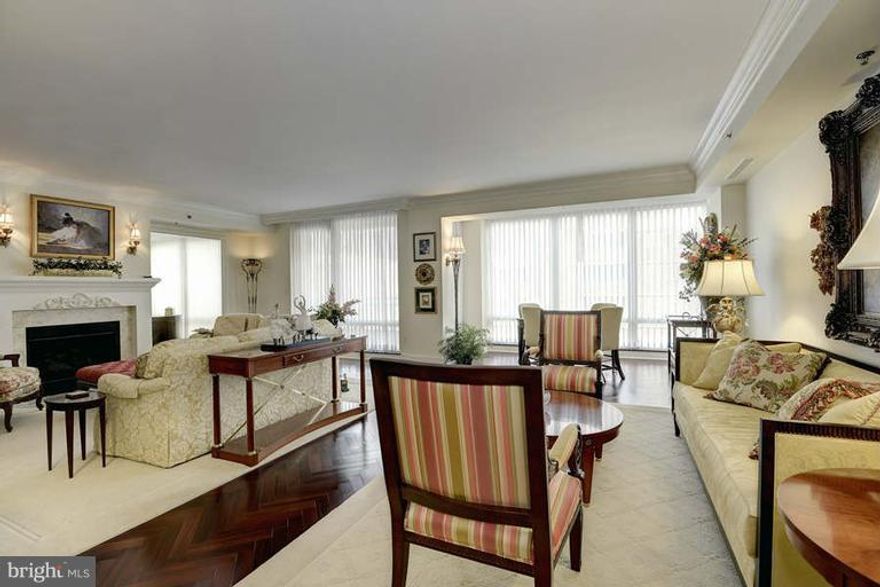 Stunning and spacious 3000+ sq. ft. Ritz apt featuring a marble entry gallery, large light-filled living room with a fireplace and balcony, gourmet kitchen, formal dining room, breakfast room, den/office, and bedroom wing with 3 bedrooms - all with baths-en-suite. 2-car assigned parking. Building features 24-hr concierge, porters, doormen, and valet parking.