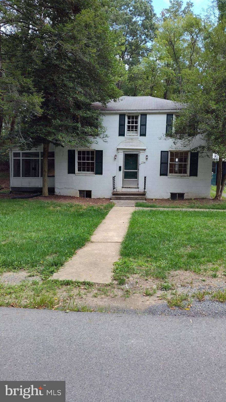 Once a beautiful home built in 1945 with original hardwood floors and windows.  Come and see what you think.  Only Cash & Conventional Loans will qualify for this home.  Located in the TOWN OF ROMNEY in an old and very nice neighborhood. IT APPRAISED FOR THIS LISTING PRICE!!!!!!!!!!!!!