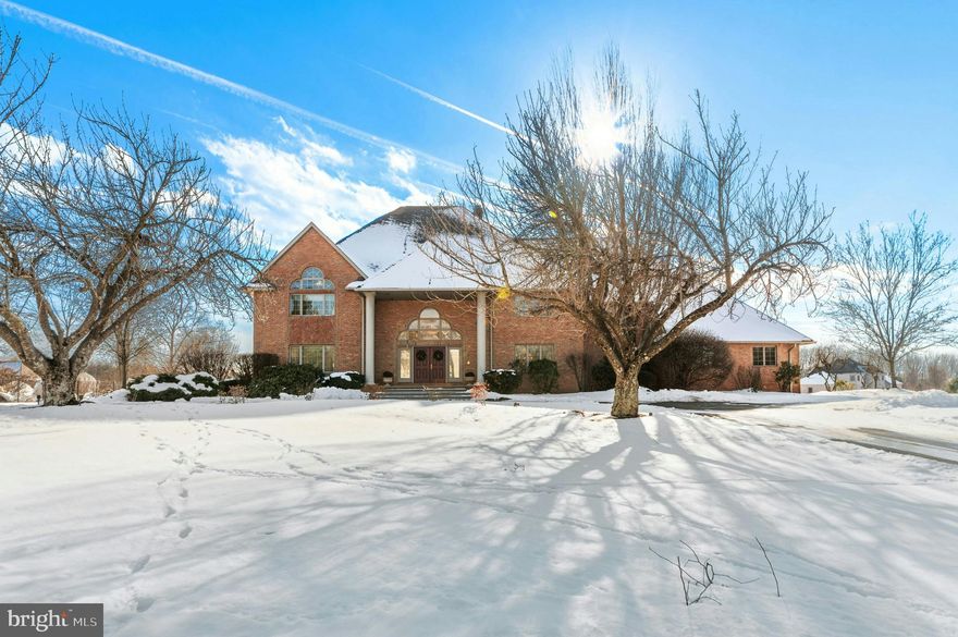 Set on a 1.5 acre parcel, this custom built home shines with curb appeal and elegant European flair. The stately brick colonial, in a desirable neighborhood in the Bethlehem school district, offers excellent proximity to the Lehigh Valley’s prominent hospitals and corporate centers.

A two story foyer with turned staircase leads to light-filled rooms featuring gleaming oak, maple, and purpleheart hardwood floors. Formal living and dining rooms are complemented by a stunning great room with soaring ceiling, gas fireplace and built-in bar. A sparkling kitchen features cherry cabinetry, expansive prep and storage space, and a rounded breakfast cove with oversized windows. A sunroom and study/office complete this level. 

Upstairs, the luxurious primary suite includes dual walk-in closets and arched French doors to a private bath with freestanding soaking tub and walk-in shower with marble accents. Three additional en suite bedrooms all boast hardwood floors and walk-in closets. A 4-car garage and brick patio with gas grill hookup are welcome amenities.

Upscale shopping and dining are a short drive from the optimal location.