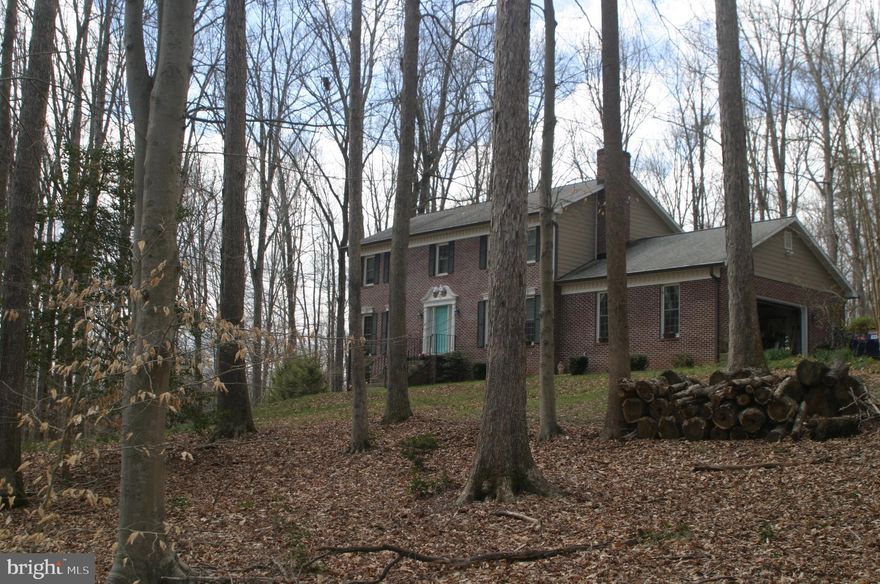 Welcome to Beaver Creek!  Loads of privacy and serenity on this 5 acre lot!  Don't miss this opportunity to own This center hall Colonial with lots of space!  Updates - Spectacular screened in porch with peaceful wooded views, entire kitchen with granite and duel propane gas cooktop range with electric oven, bathrooms, water filtration system, HVAC, electrical panel box added, large shed, handsome fence, small ponds, windows and doors, leaf filter gutter guards, roof, Hardiplank, and ADT security system.  Close to Potomac Mills, Historic Occoquan, lovely downtown Clifton, Occoquan Reservoir, short drive to VRE, Police and Firehouse just minutes away, Chinn Aquatic and Fitness Center, and lots of shopping.  Please don't let cats out.