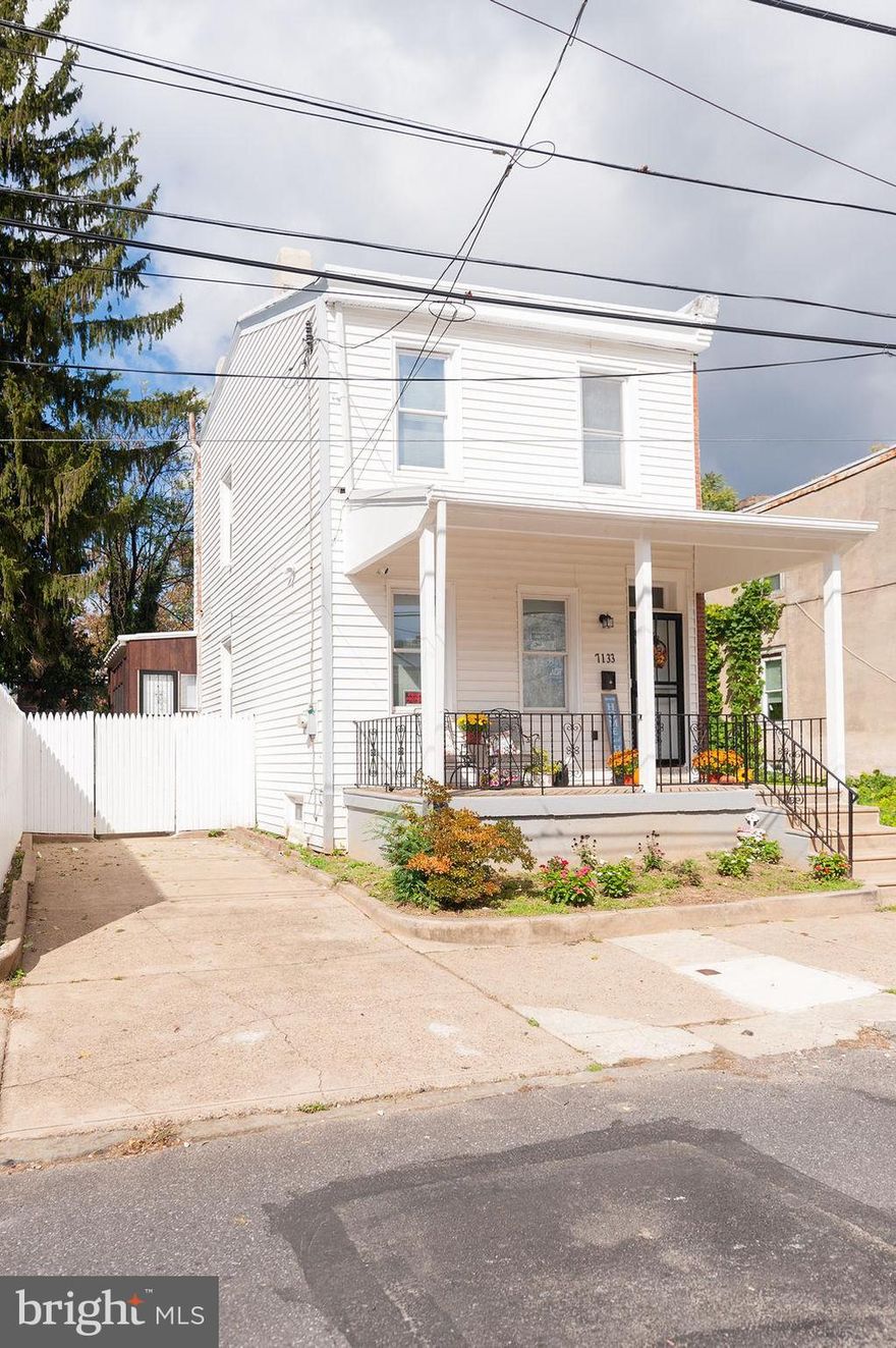This quaint and cozy three-bedroom, two-full-bath home is nestled approximately one block from Cobbs Creek Park. It is the perfect blend of modern amenities and urban living. It features a beautiful modern kitchen, which includes granite countertops and new stainless steel appliances, a dishwasher, and a garbage disposal. It has two full bathrooms, one on the 1st floor and one on the 2nd floor. This thoughtfully designed house has a very spacious living room with a separate dining room and a Sun Room with a private entrance to the private enclosed yard. The yard is large and is an ideal spot for relaxing or entertaining guests and providing an excellent space for gatherings. The interior boasts refinished original hardwood floors that add to the overall appeal. The large windows flood the living spaces with abundant natural light, creating a warm and inviting atmosphere throughout the day. The house features a new high-efficiency furnace with Central Air! Oh, I forgot to mention,  it has a roomy front porch and the convenience of a parking spot for one vehicle.