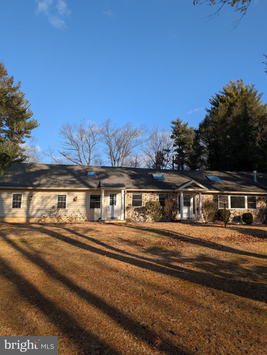 Welcome to 1427 Sugartown Rd. New construction in 2014, built on the original foundation footprint (for lower taxes), this custom stone ranch is a unique home. Designed by architects Dave Rowland & Hoffman & Associates. It has an open floor plan with vaulted ceilings, skylights, red oak hardwood floors, gas fireplace, & a fully finished basement apartment. Four bedrooms, three full bathrooms & a one-acre lot in top rated T-E schools. This home wont last long. A two car garage was added in 2023. There is abundant attic storage in the main house & garage. The partially wooded acre lot borders the Upper Main Line YMCA fields in the back & faces Rock Creek Farm in the front offering privacy & tranquility. A large eat-in island kitchen has new surfaces, steel dishwasher, fridge & microwave. A gas oven & stove-top with granite counters & deep sink, & abundant cherry cabinets. Electrical fixtures are bronze tiffany with amber glass. Ceiling fans in kitchen, living room, & main bedroom. Central air conditioning & gas heating. The gas hot water heater is new. The finished basement includes a kitchenette with oak cabinets & granite countertops, a full bathroom with steam shower, water remediation system with drain, & two sump pumps. A new backup portable generator is also included. Workshop with cabinets, bench, dehumidifier & storage shelves also included.