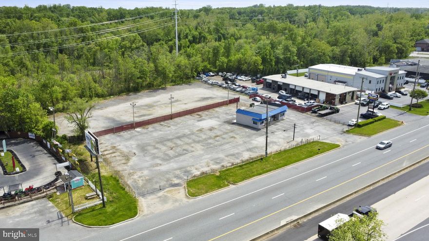 Large fenced lot with two sections, two gates ,two curb cuts. Will consider improvements  ,seeking strong tenant for long term lease , with benefit to body shop next door