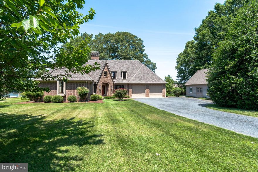 All Brick Custom Built Craftsman Style Home on Leeds Creek just off the Miles River....spanning over 3000 sqft of living space.  Step inside, and you will be greeted by the open 2 story foyer leading to the cozy living  room with fireplace  and adjoining dining room.  Grand water views are yours from the heart of the home - kitchen, breakfast area and family room, this space offers a floor to ceiling brick fireplace, cathedral ceiling, built-ins, dining and lots of cabinetry.  A privately main level primary bedroom is just down the hall, features a walk-in closet and full bath with double vanity, soaking tub & separate shower.  The 1st floor comes complete with a half bath, pantry and large laundry room with utility sink, folding table, built in ironing board and storage cabinets.  At the top of the stairs, there is the perfect set-up for a game room and/or office.  In addition, there are 3 spacious bedrooms and 2 full baths.  Other highlights of the home include - hard wood floors, recessed lighting, massive 2nd floor walk-in attic/storage area leading to 3rd floor storage area, 2 car garage, back patio with roll-out awning and mower/utility shed.  Complimenting the property is a 25x36 workshop with heat/air and an unfinished second floor (ideal for additional living quarters), a sprawling lawn adorned with trees and bushes, approx 210' of waterfront, bulkhead, pier with boat lift and deep water depth.  Whether it's a summer barbecue or a peaceful evening enjoying the water view, this home will undoubtedly become a favorite place for relaxation and enjoyment.  Upgrades include concrete crawlspace, 1st floor generator, new roof 2020, 1st floor HVAC 2023, water heater 2023, pump/air tank 2023.  Don't miss this opportunity to embrace the waterfront lifestyle you've always dreamed of, schedule your tour today!!