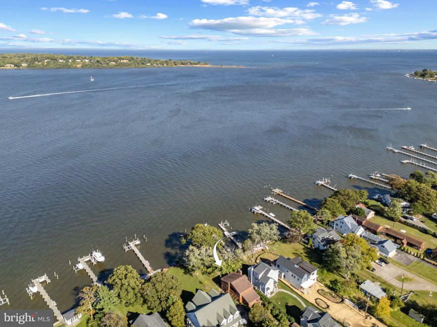 Great opportunity for a waterfront home on the shores of the Magothy River, perfectly located at the mouth of the river and sited at the best elevation to take in the views.  Embrace the waterfront lifestyle and enjoy the panoramic views of the Magothy River, Gibson Island and the Chesapeake Bay from inside and outside of the home. This classic cedar waterfront get away sits on a flat .61 acre lot surrounded by newly developed high-end homes in the serene Shore Acres community  This 3 bedroom, 3 full bath home features hardwood floors, 2 wood burning fireplaces, generously sized rooms, and convenient main level in-law suite with full bath. This charming home is ready to move in as is or provides the perfect chance to customize every detail to your liking.  Bring your imagination and your architect!  Setback off the road and sited to take advantage of the captivating views, the options are endless for creating a spectacular weekend escape or full time residence. The upper level boasts a spacious Primary bedroom with private balcony, ensuite bath, fireplace and the best views in the house.  An additional ensuite bedroom with views from the balcony completes the upper level of this fabulous home.  The Shore Acres community beach, picnic area and boat ramp are just one block away, and the property is located in the highly coveted Broadneck school district. It’s the perfect location to quickly access downtown Annapolis for shopping and dining or jump on Rt. 50 to get back to Washington, DC. If you’re looking for a fabulous setting in a great neighborhood, come take a look!