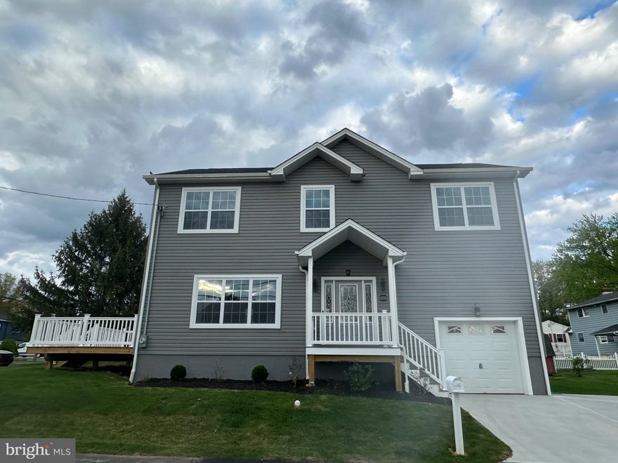 New Construction! This Home is located on a quiet street in Middletown Township, Neshaminy School District. The homes come with many high-end finishes including upgraded trim with chair rails, crown molding and shadow box molding, iron balusters on stairs, recessed lighting throughout whole house with ceiling fans and water proof Luxury Vinyl plank flooring throughout all living space, 4 Bedrooms & 3 1/2 Baths with an open-concept floor plan with one car garage and Finished Daylight Basement with exterior stairs that has to be seen!! Enter from glass entry door in to Living Room and immediately Dining room and be impressed by a brand new kitchen with 42” high white shaker cabinets with soft close doors, tile back splash, Quartz counter tops, drop in stainless sink with pullout faucet and garbage disposal, brand new GE Stainless steel appliance package includes side by side door refrigerator with ice maker, Electric cook top range, built in Microwave and dishwasher. Built-in breakfast island features Quartz counter top, Side door leading to a Deck. Living room has been updated and features water proof flooring, recessed lighting and ceiling fan, redesigned floor to ceiling built-in flat screen TV / Electric fire place setup. Powder room with ceramic tile floor. The first floor has 9 feet ceilings, Second floor features Laundry, Two Full Hall baths and four bedrooms with water proof Luxury Vinyl plank flooring, Exterior features new Deck and concrete drive way. Extras includes two new High efficiency HVAC system, 200 Amp electrical circuit breaker system, newer hot water heater. This home is conveniently located close to schools, major roads, train station and shopping. Make this home yours! Just pull up your moving truck and unpack! Listing Agent have an ownership interest in the home.