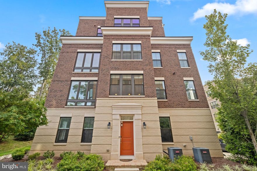 Absolutely STUNNING END UNIT luxury townhome located in the gated community of Potomac Overlook of National Harbor.  In addition to overlooking an urban skyline,  this home  is bathed in natural light and backs to a peaceful, tree-filled park, making it possibly the most beautiful location in the community!   This four level, 3 bedroom, 3 full and 2 half bath home boasts luxury features throughout including 9' ceilings,  hardwood flooring, a Bose Sound System,  and 2 gas fireplaces - one in the living room and the other on the upper rooftop terrace.  On the entry level, a light filled foyer leads to flex space that can serve as a home office, fourth bedroom, or media room. Beyond the office is a conveniently located powder room, coat closet and access to the attached two car garage.  Up the stairs, you will be wowed by the open floor plan with a gourmet kitchen and huge quartz island.  This is the heart of the home and you'll never want to leave this open, inviting space.  The adjacent living room boasts hardwood  floors, a gas fireplace, and views that will take your breath away.  Another powder room is located conveniently on this level.  Three upper-level bedrooms and elegantly designed bathrooms are located on the two upper levels.  The primary suite is a sanctuary of tranquility featuring a ceiling fan, a spacious walk-in closet, and an ensuite bathroom that boasts dual vanities and a stunning  walk-in shower.  The second bedroom at the opposite end of the hall includes a large walk-in closet and a lovely ensuite  bathroom with a tub/shower.  The laundry area is conveniently located in the hallway between the two bedrooms and is equipped with a stacked washer and dryer. On the second upper level, you'll find additional living space - a large family room with wet bar - perfect for entertaining inside or outside. Beyond the family room, you’ll find the third bedroom, walk-in closet, and a full bathroom, perfect for a guest suite, in-law suite, or another office.  One of the unique features of this home is the amazing rooftop terrace with its outdoor fireplace.  Relax on the terrace with a beverage while taking in the majestic views of near and far.  This gated community's Condo fee includes lawn maintenance, sidewalk and road snow removal, trash, water, and sewer. The community has walking paths, common grounds, a dog park, and security.  You just can't beat the location and Potomac Overlook at National Harbor is a wonderful place to call home.