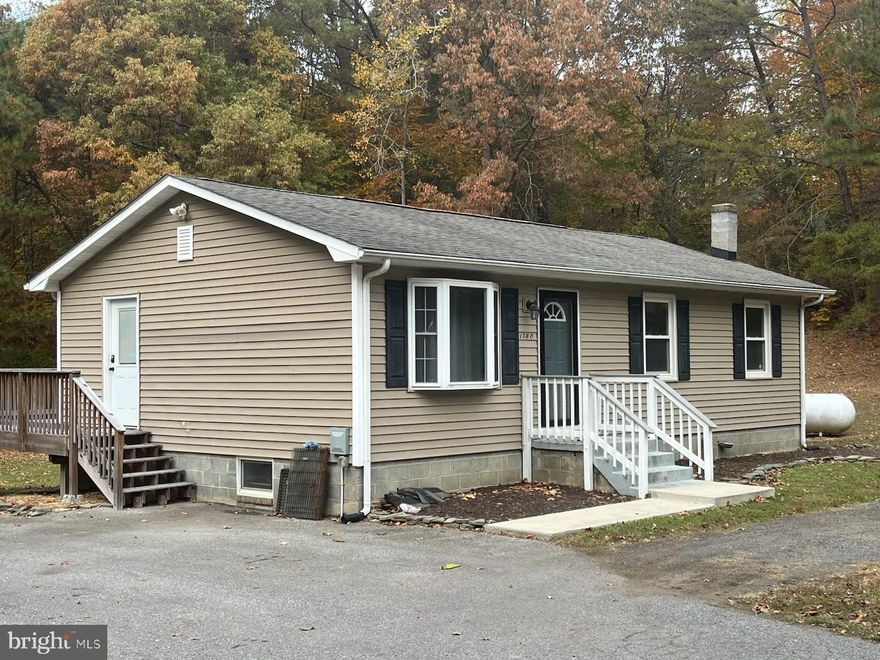 What a great one-level rambler featuring an open floor plan with three bedrooms and a full bath! This entire level has been recently renovated and is clean and ready for move-in! There's a nice deck off the kitchen/dining area and a laundry room down the stairs leading to the basement. Basement is used by owner and will share the laundry room. Never worry about where to park in this circular driveway and other parking areas, too! All utilities are included (electric, WIFI, cable and tankless hot water). Renter's insurance required. Applications submitted through Listing2Leasing and available through listing agent. Pets case-by-case. No smoking on property.