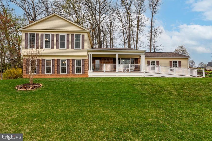 Welcome to 6141 Snowdens Run Rd in the sought after neighborhood of Acorn Village! Tucked away on a beautifully landscaped .46-acre lot, this home offers more than just comfort-it delivers an experience. Step into the backyard and discover your own private retreat: an elevated hilltop perch at the rear of the property capturing sweeping treetop views and gorgeous sunsets Or a private patio just outside of the private entrance to the beautifully designed In-Law suite. Both spots are perfect for morning coffee, evening wine or simply soaking in the peaceful surroundings. Lots of special features include double hung/double pane/tilt-in Pella windows and a Pella sliding glass door (2017/2018), 6-panel doors and window treatments throughout, beautifully refinished hardwood flooring (2025) in the Foyer, Kitchen, Breakfast Room and Dining Room, new carpet (2025) in the Living Room, Stairway, Family Room and In-Law Suite. The main level In-Law suite addition (2018) includes a Bedroom area (12’9” x 11’2”), full size double closet, recessed lighting, Living  area (15’9” x 11’2”) with a ceiling fan/light, more recessed lighting, built-in shelving, cabinets, drawers, counter space, built-in space for the Frigidaire mini-fridge/freezer, 2 full size windows, Mitsubishi mini-split for heating and cooling, ADA compliant Full Bathroom with ceramic tile flooring, a roll-in shower with ceramic tile surround, built-in seat, grab bars, brushed nickel 7” spray pattern shower head, niche and corner shelves, a roll-up vanity, brushed nickel faucet and lighting, wall storage cabinet. Laundry area has LVP flooring, built-in shelving and cabinets, LG washer, Whirlpool dryer, a wall mount ironing board and Linen closet. Hallway with LVP flooring leads to the private In-Law Suite entrance/exit to the back private patio. Large Family Room offers new carpet, ceiling fan/light, built-in bookcases with storage cabinets below, a wood stove, brick hearth and a charming sliding barn door. Refreshed Kitchen/Breakfast Room (2025) features refinished hardwood floors, 2 Pantry closets, painted cabinets, new hardware, granite countertop, deep stainless-steel sink and single-handle pull down sprayer faucet, stainless-steel Whirlpool appliances:  smooth top 5-burner range with double oven (2023), side-by-side refrigerator (2024), dishwasher (2021), built-in microwave (2021) and Turbo Grind Glacier Bay garbage disposal (2025). Upper Level includes LVP throughout. Spacious Primary BR includes a dressing area (7’6” x 3’), wall mirror, vanity top, LED lighting and walk-in closet, beautifully remodeled Ensuite Primary Full BA (2023) with Italian ceramic tile flooring and shower surround, niche, corner shelves, brushed nickel wall mount hand-held shower head, frameless glass shower door, vanity, medicine cabinet, brushed nickel faucet and lights. Full Hall Bathroom (remodeled 2023) includes Italian ceramic tile flooring and tub/shower surround with a niche, brushed nickel wall mount hand-held dual shower head, vanity, wall mirror, medicine cabinet, brushed nickel faucet and lights. 4th Level sub-basement (27’ x 20’) features a workbench, lots of peg boarding, built-in shelving and shop lighting, Bosch Heat Pump (2023), Rheem Marathon Water Heater (2005). Full front porch addition (2018) with composite flooring provides a relaxing spot to unwind and soak in the sunsets. Composite ramp (2018) from the driveway allows for convenient access in and out. Architectural shingle roof (2018). Rear patio (18’ x 10’8”), deck (12’ x 12’) and flagstone patio (18’11” x 14’7”) offer lots of places to gather with family and friends. Shed (16’x 8’) with double door and built-in shelving. Extensive stone retaining walls, lots of beautiful landscaping and a stairway to your hilltop perch create an outdoor retreat that blends elegance with nature, while offering stunning views from above!