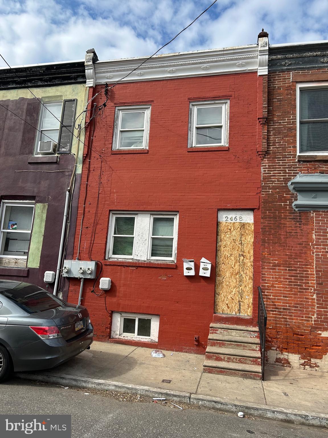 2468 North Dover St., Strawberry Mansion, PA 19132, is a two-unit duplex featuring two separate electric meters. There is a small backyard available. Each unit consists of one bedroom and is zoned RSA5. Public records indicate that it is classified as a duplex, with land use designated for converted apartments. The property also incurs charges of $500 for trash collection as of 2025.
The owner cannot confirm whether the property is a legal duplex; therefore, the buyer is responsible for conducting their own due diligence. The property is being sold in "as-is" condition. Both units were previously managed by a property management company, which has since been abandoned. The seller has no knowledge of the previous or current condition of the property.
The seller is not local and has never visited the property. The first floor is largely a shell, while the second floor is livable. However, the entire house requires cleaning and renovation. The seller cannot confirm whether the property is registered with the city as two units; buyers must verify all zoning and land use information independently.
The seller will not provide any warranties or guarantees, and the disclosure statement is blank due to the seller’s lack of information.