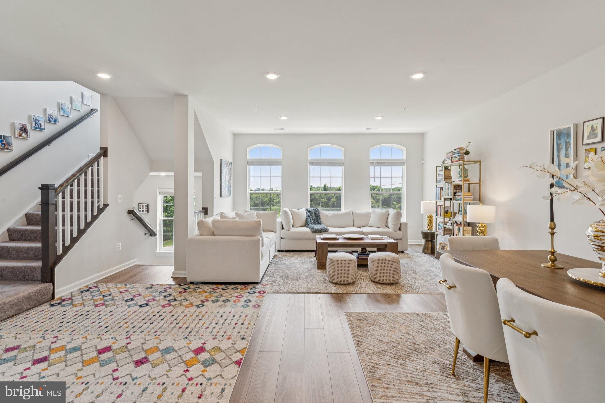 Sellers are sweetening the deal with a $10,000 credit at closing for the lucky buyer!! Welcome to 5504 Lanteen St– A Modern Gem in Lanham! This stunning, newly built home offers the perfect blend of space, style, and functionality. Step inside to discover a bright and airy open-concept layout featuring a spacious living room filled with natural light, a large dining area, and a beautifully designed kitchen with granite countertops, stainless steel appliances, an oversized island with seating, and ample cabinet space. Upstairs, the expansive primary suite impresses with tray ceilings, generous closet space, and a luxurious en suite bath complete with a double-sink vanity, soaking tub, and separate glass-enclosed shower. All bedrooms are well-sized with plenty of natural light, offering comfort and flexibility for any lifestyle. Enjoy your morning coffee or unwind in the evenings on the private balcony with peaceful views. Additional features include modern finishes throughout, wide plank flooring, recessed lighting, and convenient upper-level laundry. Located in a desirable and fast-growing community in Lanham, this home is just minutes from major commuter routes, shops, restaurants, and parks. Don’t miss the opportunity to own this beautifully maintained and move-in ready home—schedule your tour today!