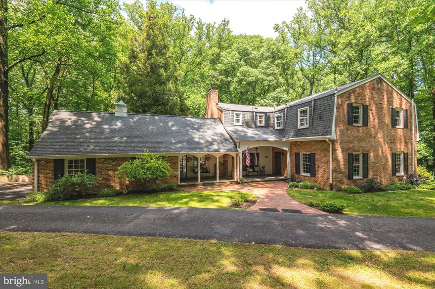 Ideally situated in the heart of close-in Potomac, and in the prestigious Walt Whitman School Cluster, you'll hardly believe the peace and serenity you can find as you wind down the private drive into this spectacularly gorgeous two and a half acre property. This property offers the best of all worlds from open, flat grass for kids to play to expansive decks for the grown ups to entertain, from the privacy of old growth trees to the relaxing indoor/outdoor space of the screened porch and covered front patio. Through the front door you'll enter the impressive and welcoming Entry Foyer with a sweeping curved staircase and gleaming hardwood floors.  The Main Level boasts 10' ceilings and lots of natural light. The Foyer is open to the spacious Formal Living Room to your right and on your left to the charming Family Room with  a full brick wall surrounding the fireplace/wood stove.   The updated Eat-In Kitchen with Granite Counters and Upgraded Stainless Steel appliances boasts beautiful views from all windows including the bay window in the Eating Area. Last, but not least on the main level is the  screened porch with a paneled ceiling, brick wall and tile flooring.  This screen porch could easily be closed in to create a first floor home office with a separate entrance.   There's a powder room with a custom bureau vanity and granite counter. The Upper Level offers similarly generously proportioned room sizes and a versatile floor plan. The Primary Suite offers not only ample bedroom space, but also a sitting room/office/dressing area and His & Hers Full baths.  The second bedroom is large and features an en-suite bathroom. Rounding out the Upper Level are two more Bedrooms, a hall Full Bath. The daylight filled, walk-out Lower Level has plenty of space for anything you need whether it is a large Recreation/Media Room with a built-in full bar and custom wainscoting, a full bedroom suite, an exercise room and a hobby room along with extensive storage space.  In addition to your own natural playground, there is easy access to the Gold Mine Trails at Great Falls National Park.  Biking and hiking along the C&O Canal or climbing Billy Goat Trail will give the nature lover hours of enjoyment.  There is the potential for membership at the River Falls Swim/Tennis Club with loads of summer activities.   What more could you want??  Your own private oasis within 15 miles of Downtown DC, twenty minutes non-rush hour to Dulles International and Reagan National airports.  There's easy access to I-495, the Beltway; I-270, the BioMed Corridor, Westfield Montgomery Mall and, for every day shopping, Potomac Village.  Come take a look today!!