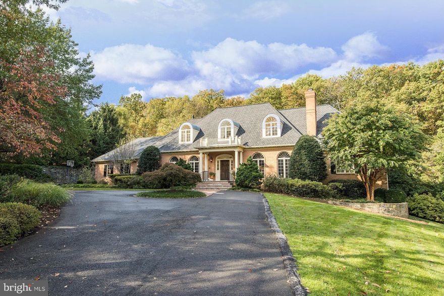 NEW PRICE! AMAZING VALUE for over 8,000 Sq. Ft. on 3 Levels!! Gorgeous 4 sides brick colonial with a main level master. Loaded with upgrades & quality features. 3 car side load garage, beautiful oversized pool & a private setting. Stunning windows fill rooms with natural light. Spacious rec room, billiard room, gym, wet bar. Beautifully decorated! Renovations by BOWA.