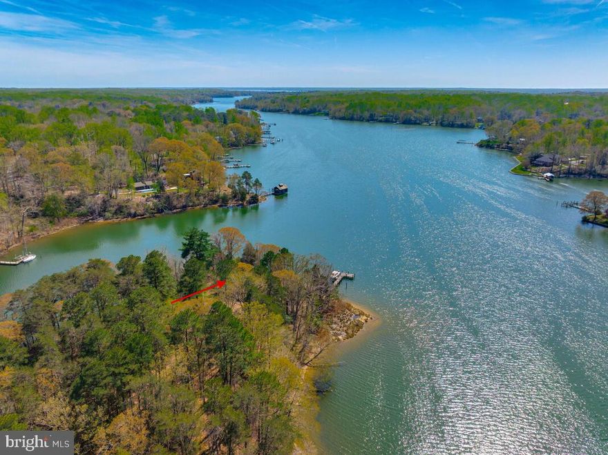 This one-of-a-kind private peninsula offers panoramic waterfront views on an expansive 5.2-acre homesite. It is conveniently equipped with an included pier and boat lift. These rare characteristics make it a strong investment opportunity. Notably, this peninsula was once a ferry wharf between Calvert and St. Mary’s Counties and was owned by Pulitzer Prize winner Thomas Stokes, who hosted Harry Truman here; historical documents and memorabilia are available. The 270° waterfront views are unobstructed by other houses providing a sense of vast personal space, which makes the 5.2 acres feel significantly larger. While having the benefit of being protected, St. Leonard Creek also serves as a deep-water, large boat accommodating, inlet of the Patuxent River, flowing directly into the Chesapeake Bay, with seamless access to the wide open ocean making the world a playground right from your backyard! Much of the furniture conveys.