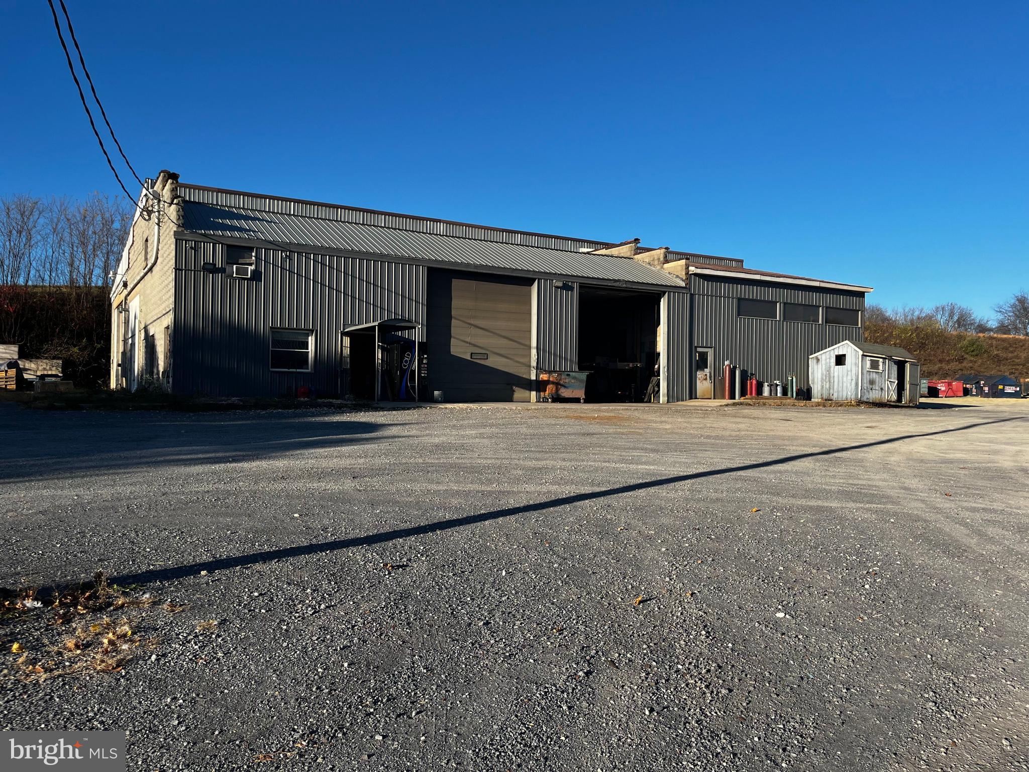 95' x 80' shop on a 4.5-acre parcel zoned Commercial not far off interstate 80 with road frontage on Route 254. Building has two 13'5"wide by 14" high doors on the front and one 14' x 14' garage door on the side, as well as a  19.5' x 14' sliding door and a smaller 8 x12 garage door. There are multiple office spaces and two bathrooms. A 55' x 38' Quanta hut with radiant floor heat is on the property as well. Lots of parking. Currently being used as a metal shop but could be used for many things.