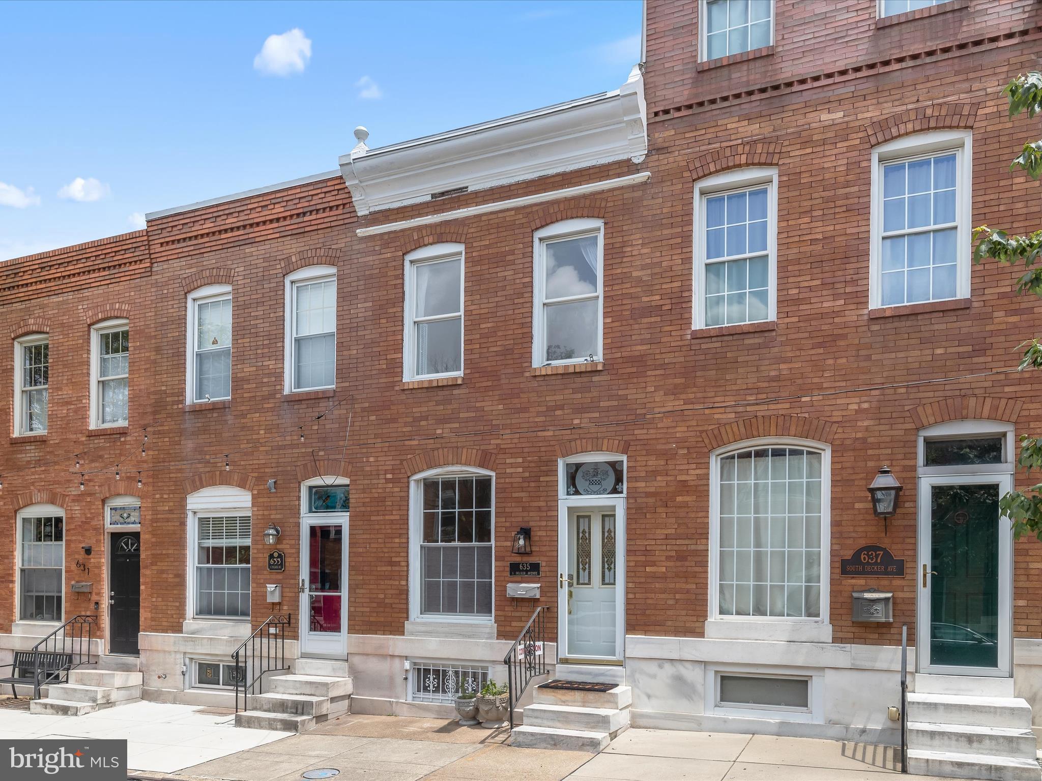 Welcome to this beautifully maintained brick exterior townhome nestled in the heart of Canton, offering the perfect blend of charm, style, and convenience. Ideally located just moments from the Inner Harbor, Patterson Park, the National Aquarium, top dining and shopping destinations, and major commuter routes including I-95, I-83, and I-395, this home puts the best of Baltimore at your doorstep. Enter through the elegant front door or from the rare one-car parking pad, an exceptional city luxury, into an open floor plan accented by gleaming hardwood floors, plantation shutters, and an etched glass transom window that hints at the architectural character found throughout. The gourmet kitchen is a true showpiece, featuring Quartz countertops, a shimmering ceramic tile backsplash, stainless steel appliances, and a Tiffany-inspired chandelier that adds a touch of timeless elegance. Upstairs, the spacious primary bedroom is filled with natural light and features soaring ceilings, a soothing neutral palette, and a walk-in closet. A second bedroom offers a charming exposed brick accent wall and built-in storage, while the hall bath has been stylishly updated with a modern vanity and contemporary lighting. The partially finished lower level provides flexible space ideal for a media room, game room, or guest area, complete with a powder room and access to the rear exterior. This is city living at its finest. Don’t miss your chance to call this Canton gem home.