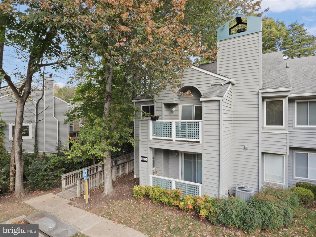 Photo of 11709 Summerchase Circle #D, RESTON, VA 20194 (MLS # VAFX2276010)