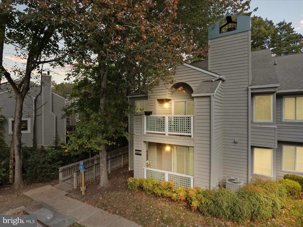 Photo of 11709 Summerchase Circle #D, RESTON, VA 20194 (MLS # VAFX2276010)