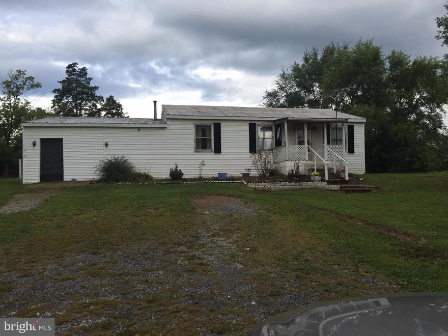 Great commuter location! Conveniently located near the new P&G facility being built and the new up and coming Walmart location!  Home is sold as-is where- is. Handyman/Contractor/Investment dream!  2 Bedroom 1 Bath on .96 acres.