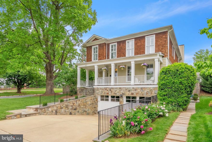 Welcome to 7805 Westfield Drive – a beautifully appointed 5-bedroom, 4.5-bath home in the top-ranked Walt Whitman School District on a beautifully landscaped corner lot. Perfectly blending elegance and comfort, this home offers over 5,000 square feet of thoughtfully designed living space. A charming flagstone walkway leads to the expansive front porch, setting the tone for this warm and inviting home. Inside, enjoy gleaming hardwood floors on the main and upper levels, detailed crown molding, and abundant natural light. At the heart of the home is the stunning gourmet kitchen – the true centerpiece – featuring quartz countertops, stainless steel appliances including a sub-zero refrigerator,  Jenn-air oven and stove, new Miele dishwasher, wine fridge, ample cabinetry, and an inviting breakfast area. Whether hosting or enjoying a quiet morning, this space seamlessly connects to the expansive family room with a gas fireplace and leads to the private flagstone patio, creating the perfect indoor-outdoor flow for everyday living and entertaining. The main level also features formal living and dining rooms, crown molding, a powder room, and beautiful hardwood floors that continue upstairs. The upper level offers four spacious bedrooms and three full baths, including a luxurious primary suite with a spa-inspired en-suite bath, soaking tub, separate shower, double vanity, and a large walk-in closet. A second bedroom includes an en-suite bath, and a laundry room adds convenience. The finished lower level offers a fifth bedroom, full bath, large recreation room with a second gas fireplace, and abundant storage. Additional highlights include a 2-car garage wired for an EV, a whole-house generator, and meticulously maintained landscaping. All just minutes to downtown Bethesda, Metro, shops, dining, and an easy commute into DC – this home delivers both luxury and lifestyle in a premier location.