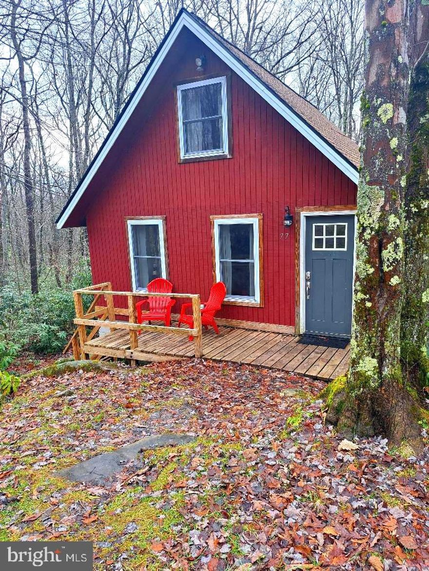 Sale includes 2 additional lots: Tax I.D. #1206031994    0.59 Acre & Tax I.D.# 1206019064   0.53 Acre
Cozy & Artistic 2 bdr , 1 bath cabin with open floor plan.   Surrounded by nature at its finest.  Home offers gorgeous one of a kind stonework and mosaic tile. Spend the cold evening nestled up in front of the fireplace or enjoy sitting on the front porch with your morning coffee.   This little gem is located in the Youghiogheny Mt. Resort, perfect for a getaway home, hunting cabin, so many possibilities.  Call now to take advantage of this amazing opportunity!